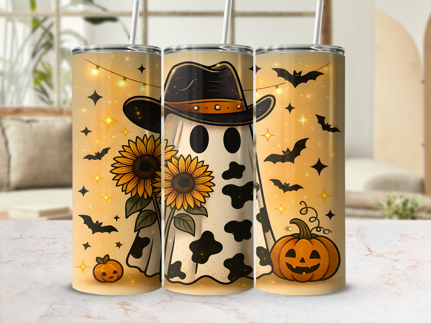 Three tumblers with Halloween designs featuring ghosts, sunflowers, bats, pumpkins, and lights.