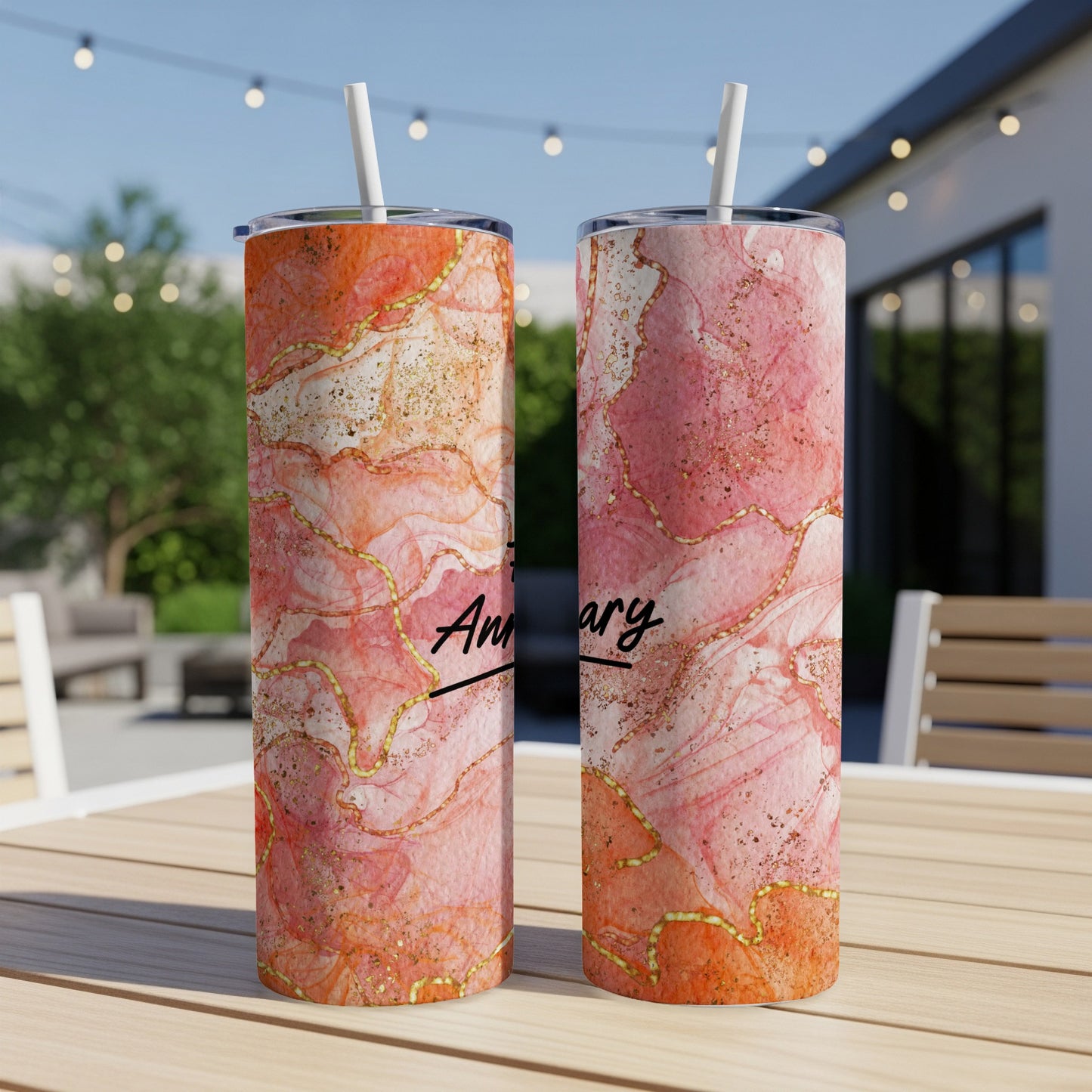 Two tumblers with pink marble and gold glitter design, reading "Anniversary".