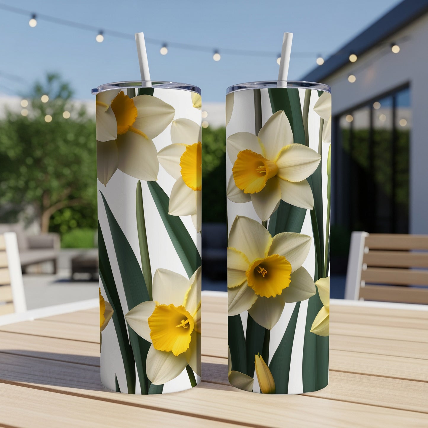 Two tumblers with a yellow and white daffodil floral pattern.