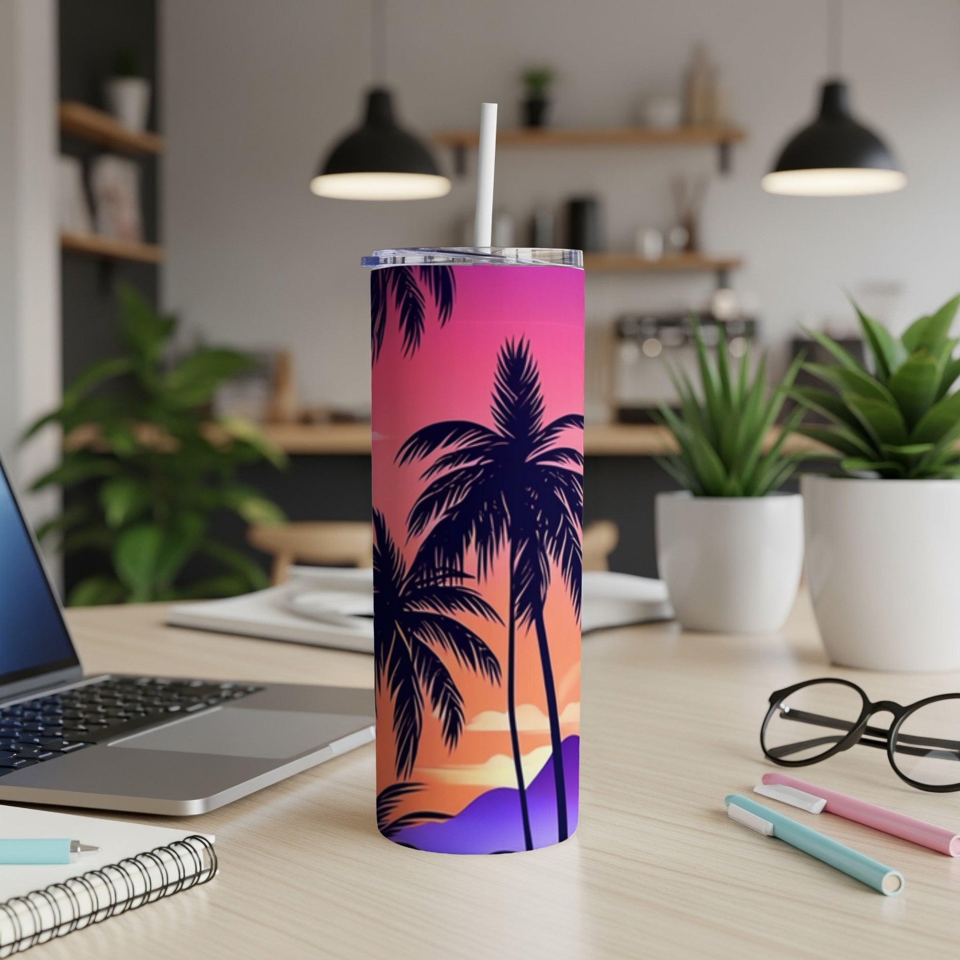 Tall tumbler with colorful sunset and palm tree silhouette design.