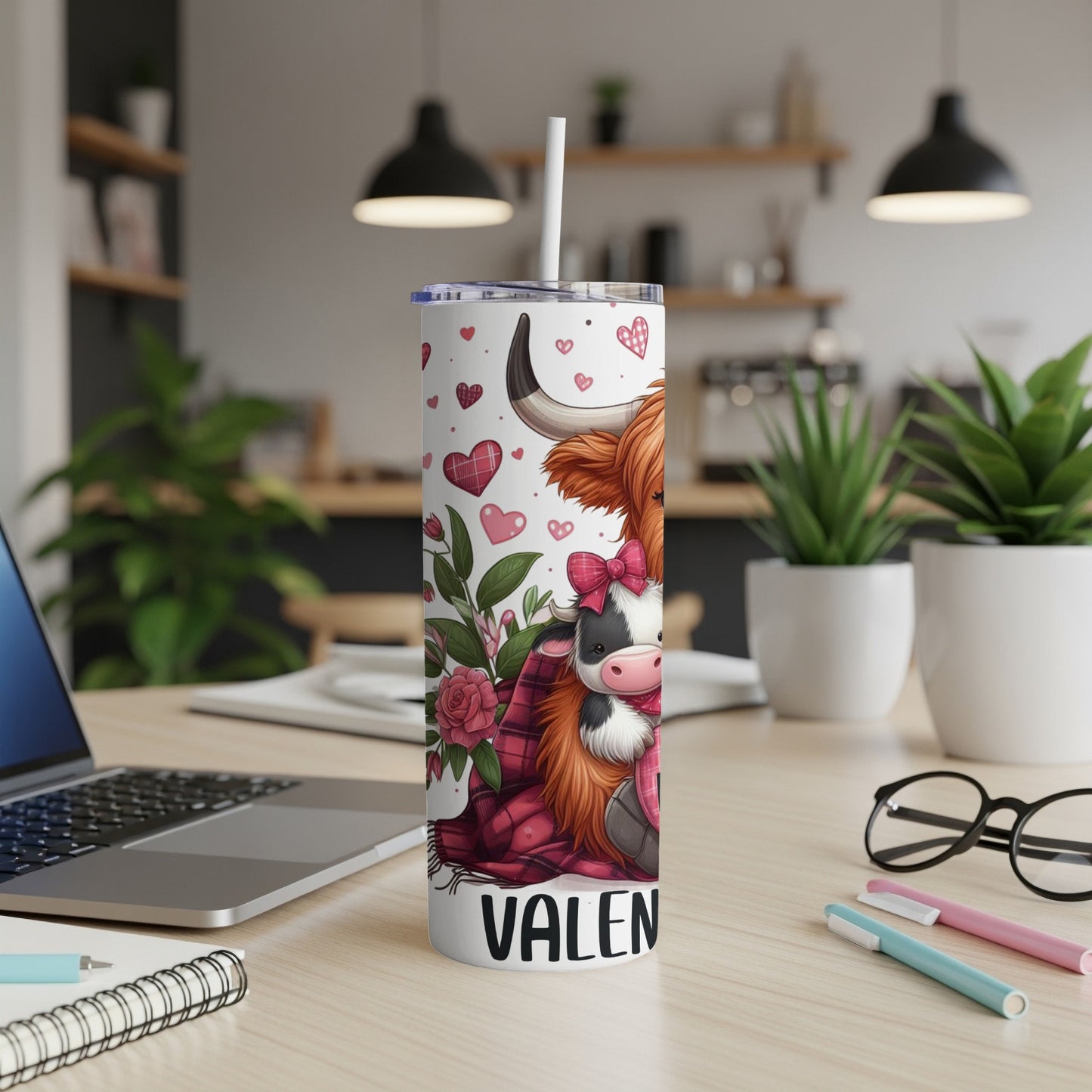 White tumbler with a cartoon Highland cow and hearts, labeled "VALEN".