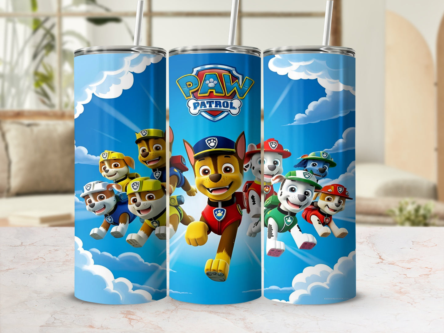 Paw Patrol characters Chase, Marshall, and Ryder on blue tumblers with clouds.