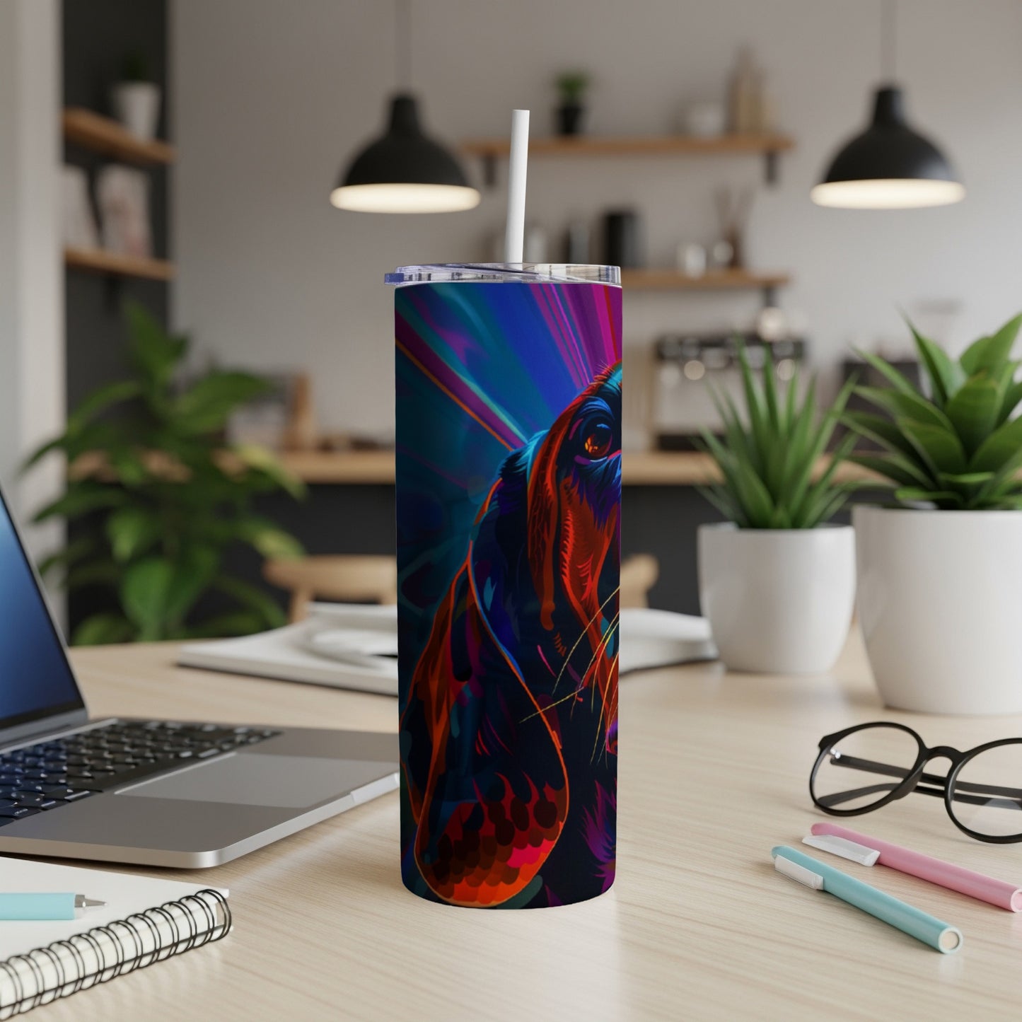 Colorful abstract dog face on a blue gradient skinny tumbler.