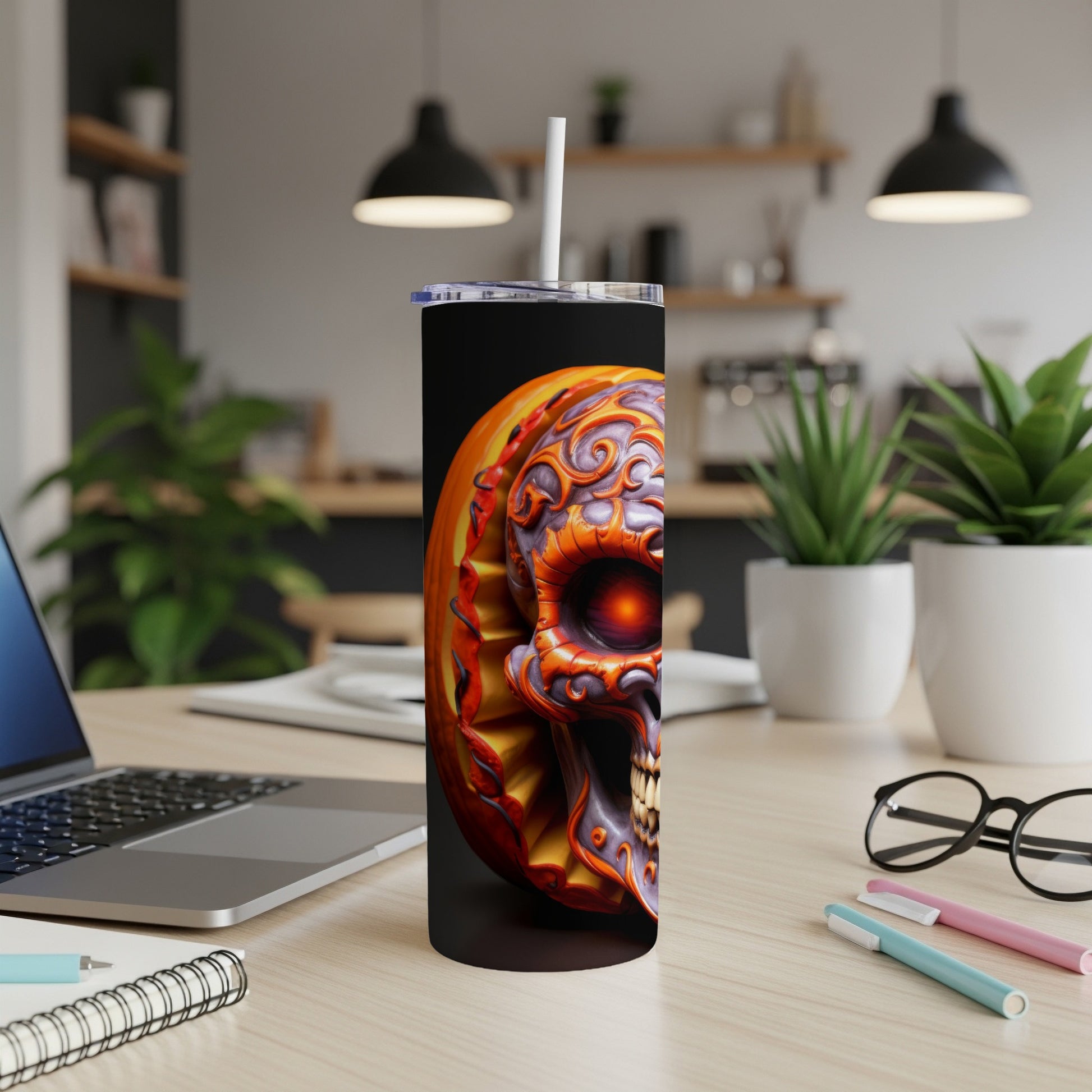 Tumbler with a colorful, ornate skull and pumpkin design, featuring a straw.