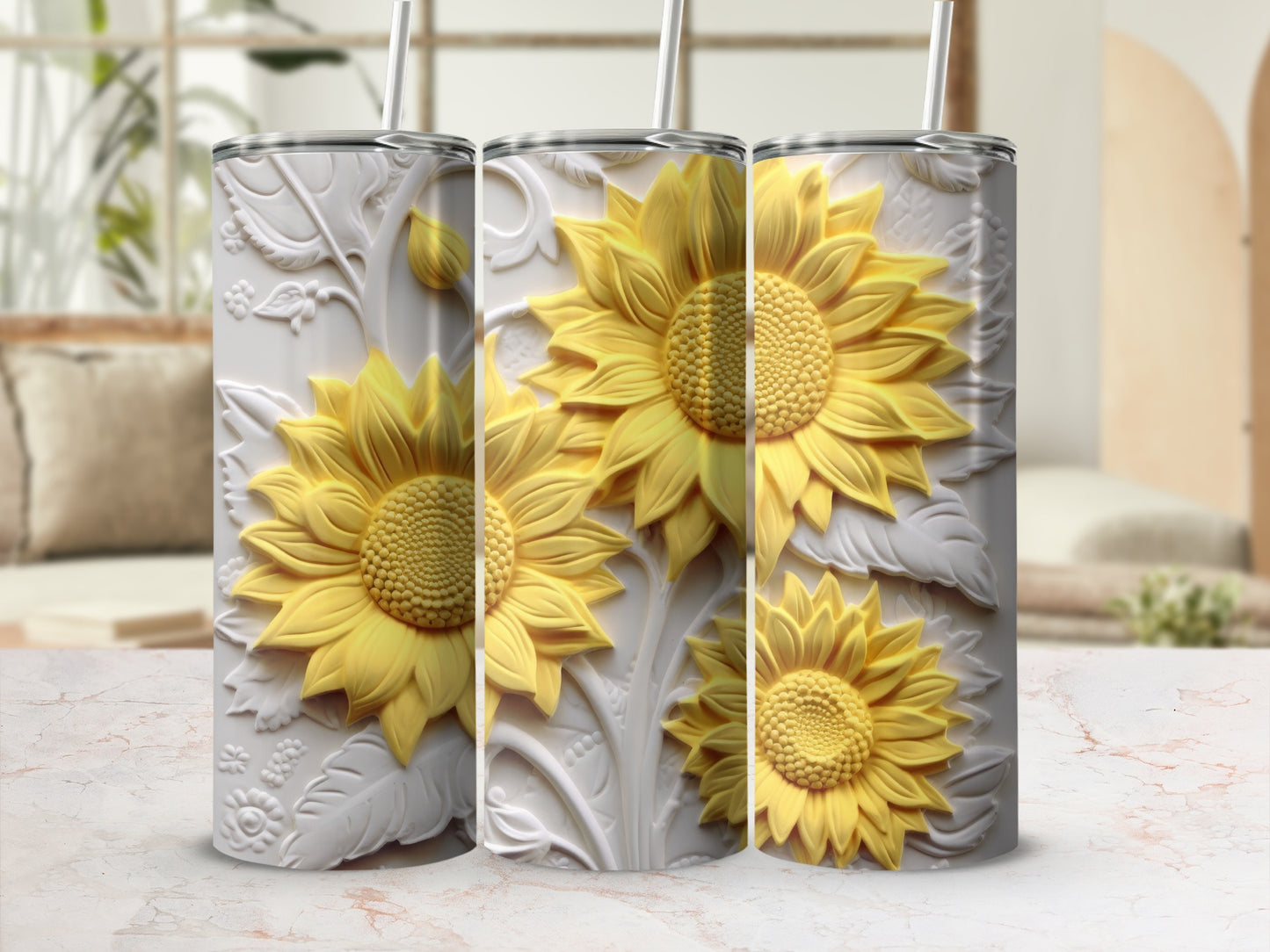 Three textured tumblers with embossed sunflowers and leaves.
