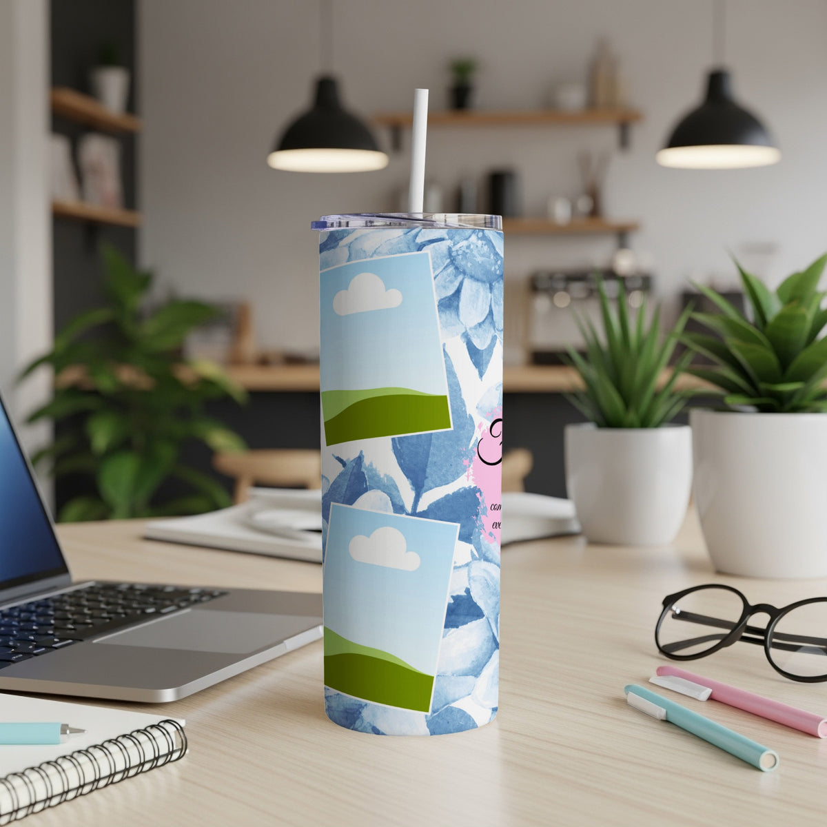 Tall tumbler with blue floral pattern and blank photo frames.