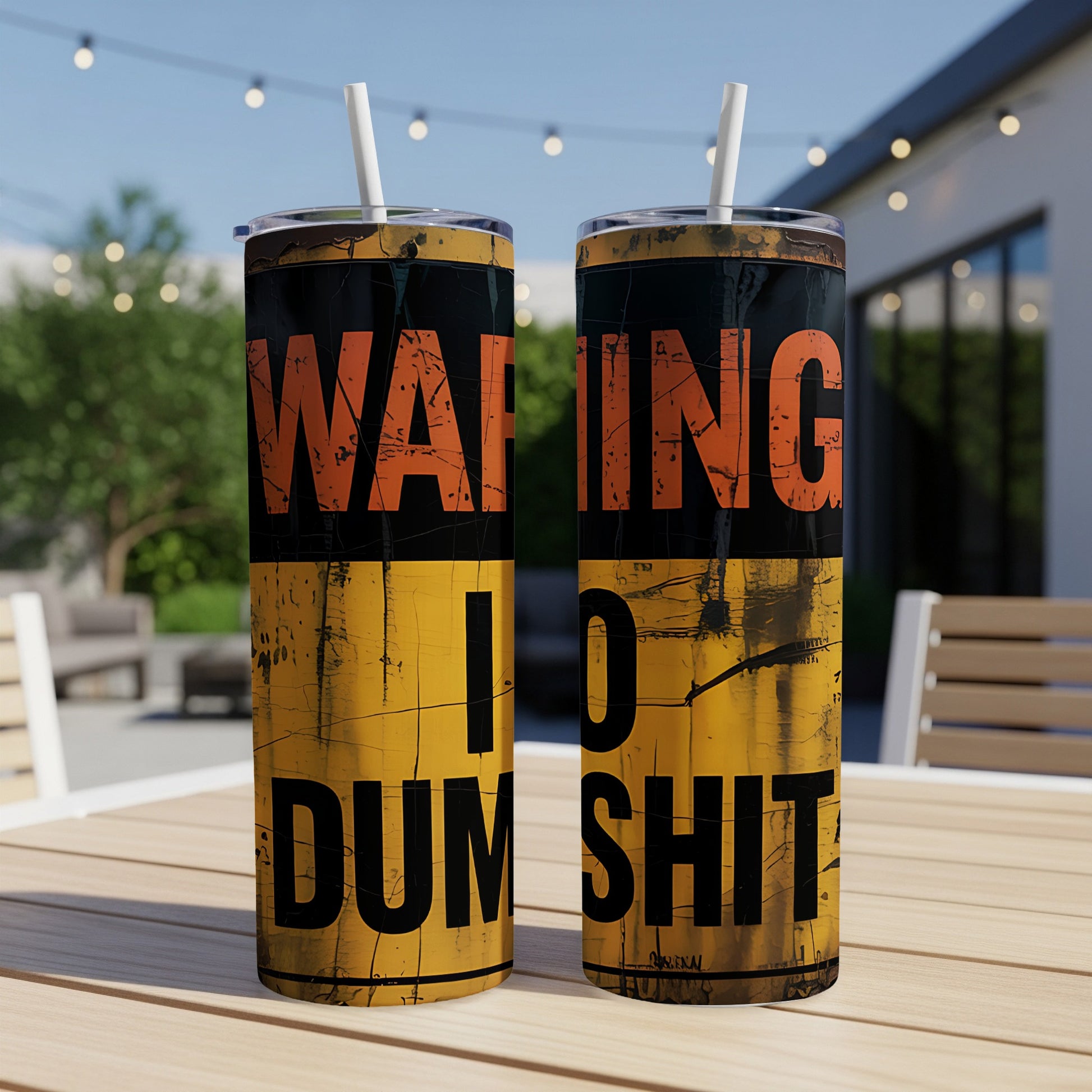 Two tumblers with "WARNING I DO DUMB SHIT" text on a table.