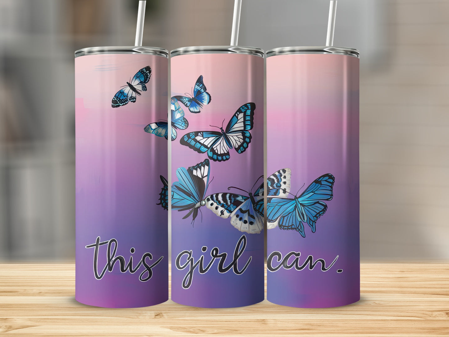 Three tumblers with blue butterflies and the text "this girl can."