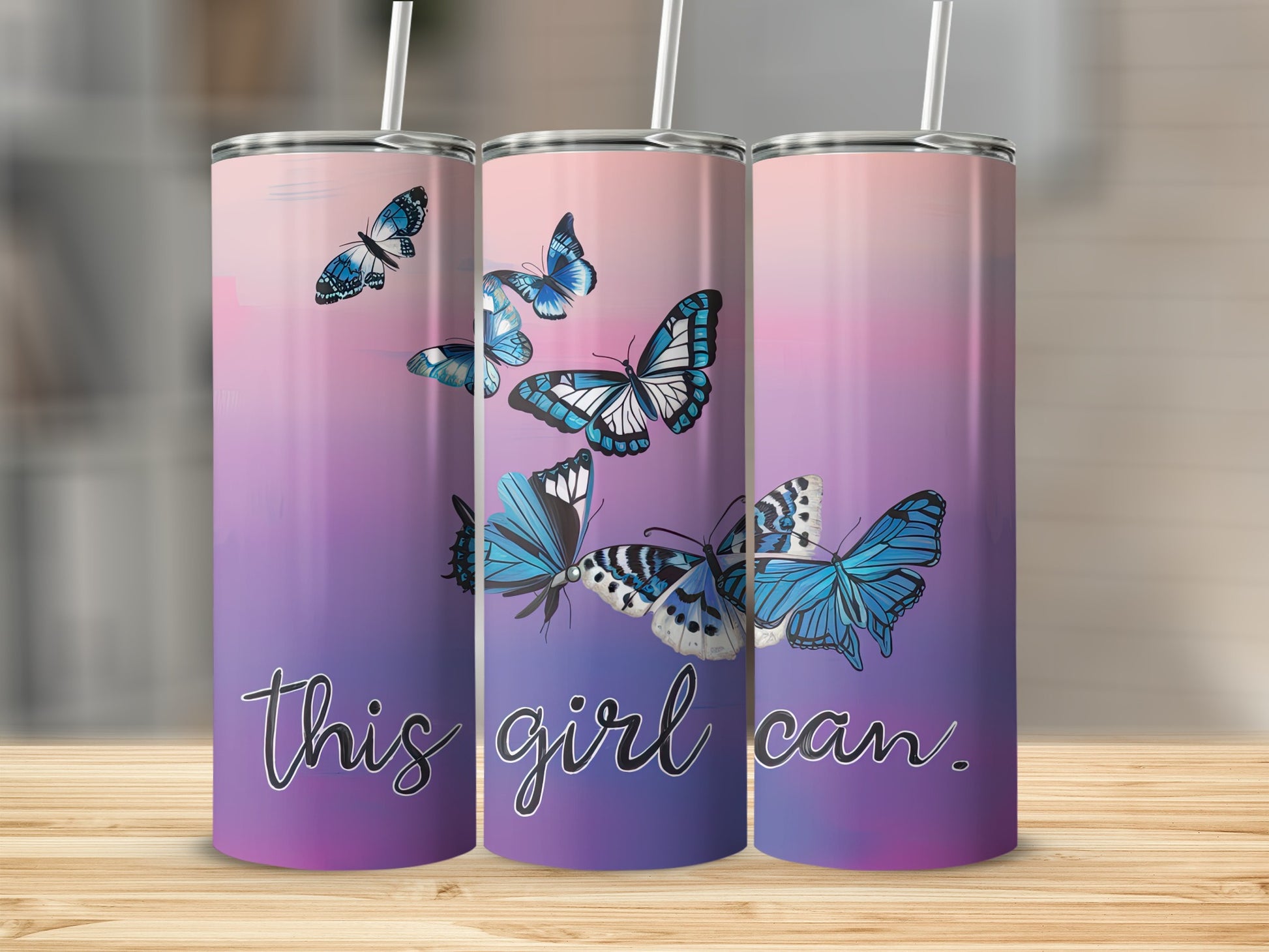 Three tumblers with blue butterflies and the text "this girl can."