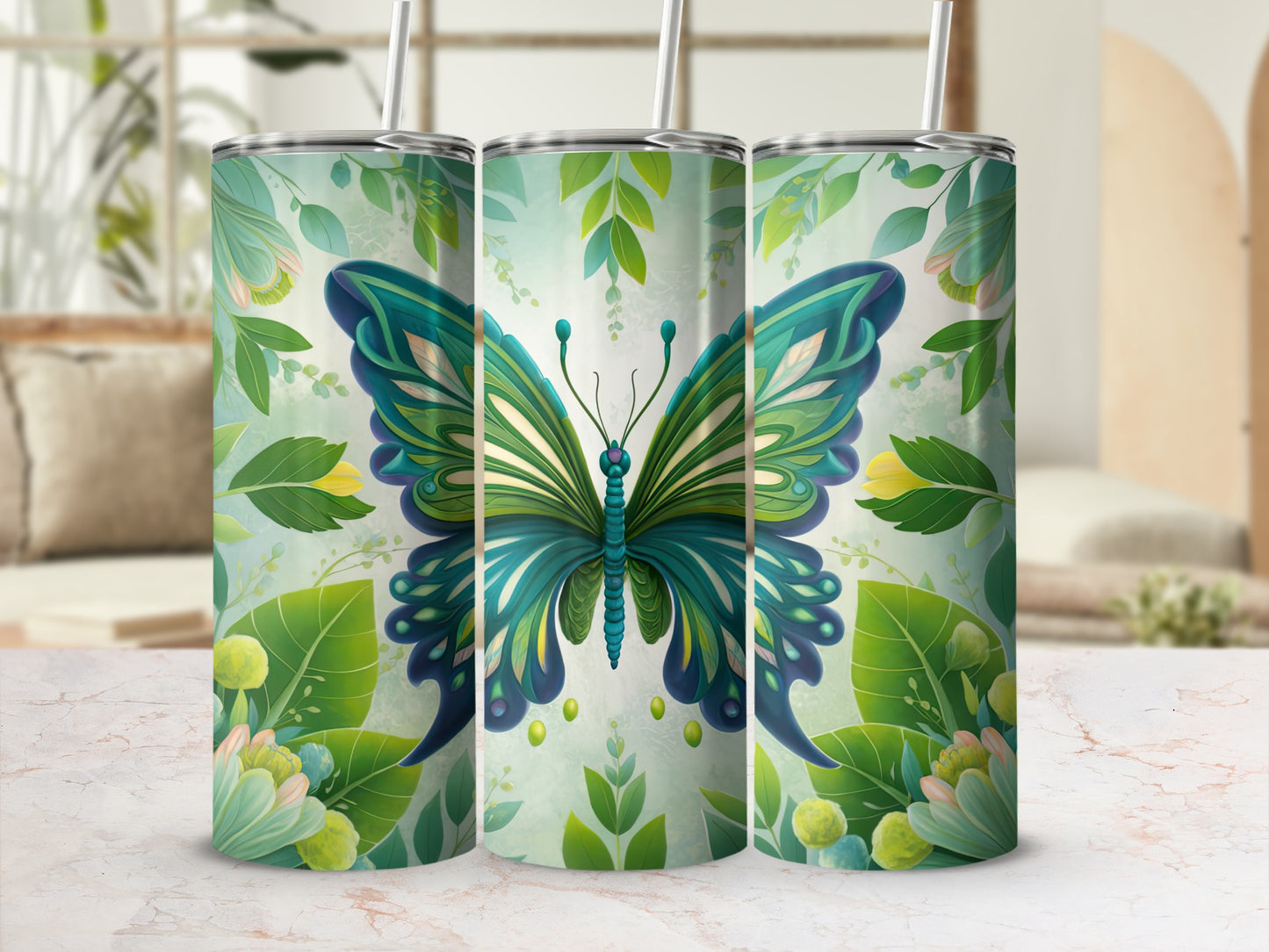 Three tumblers with a blue and green butterfly and floral design.