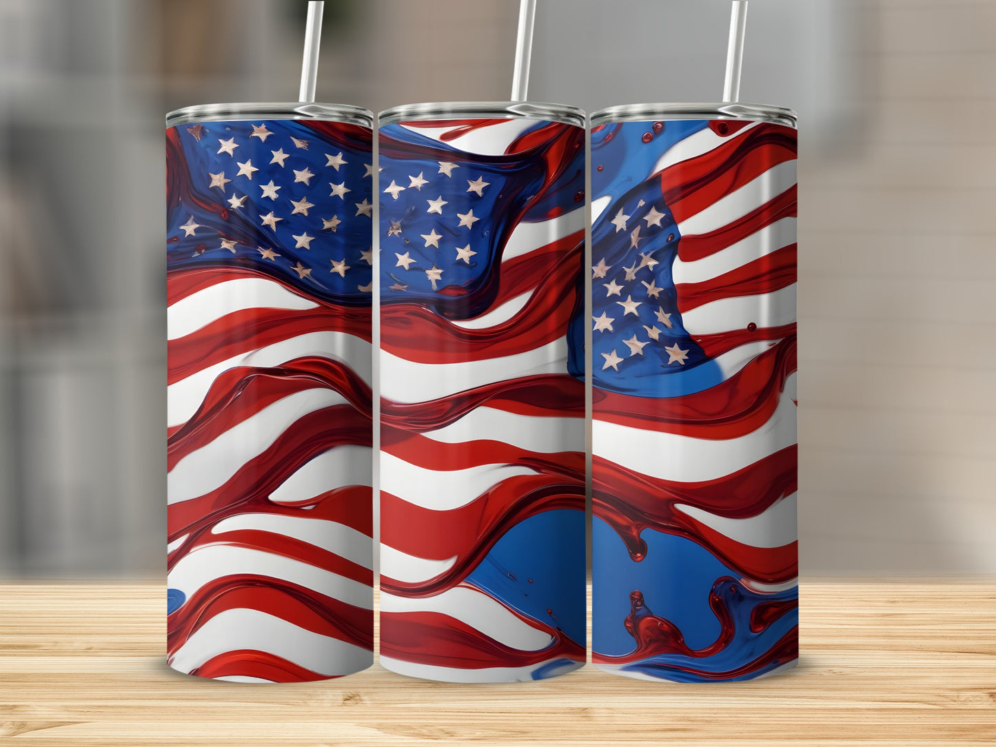 Three tumblers with an abstract American flag design on a wooden surface.