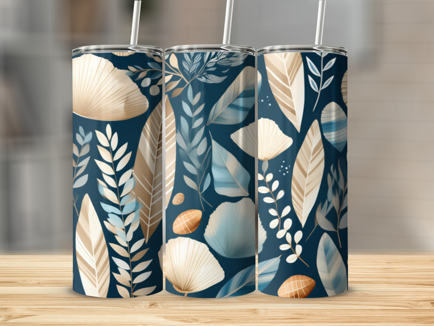 Three tall tumblers with a blue, beige, and white leaf and feather pattern.