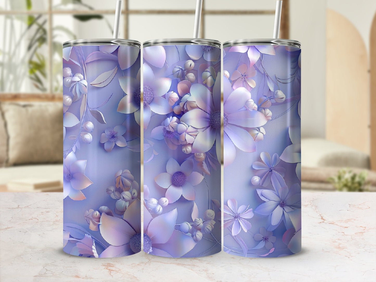 Three tumblers with a lavender floral pattern and straw, against a blurred background.