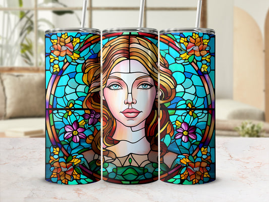 Stained glass design of a woman's face surrounded by flowers and blue geometric patterns.
