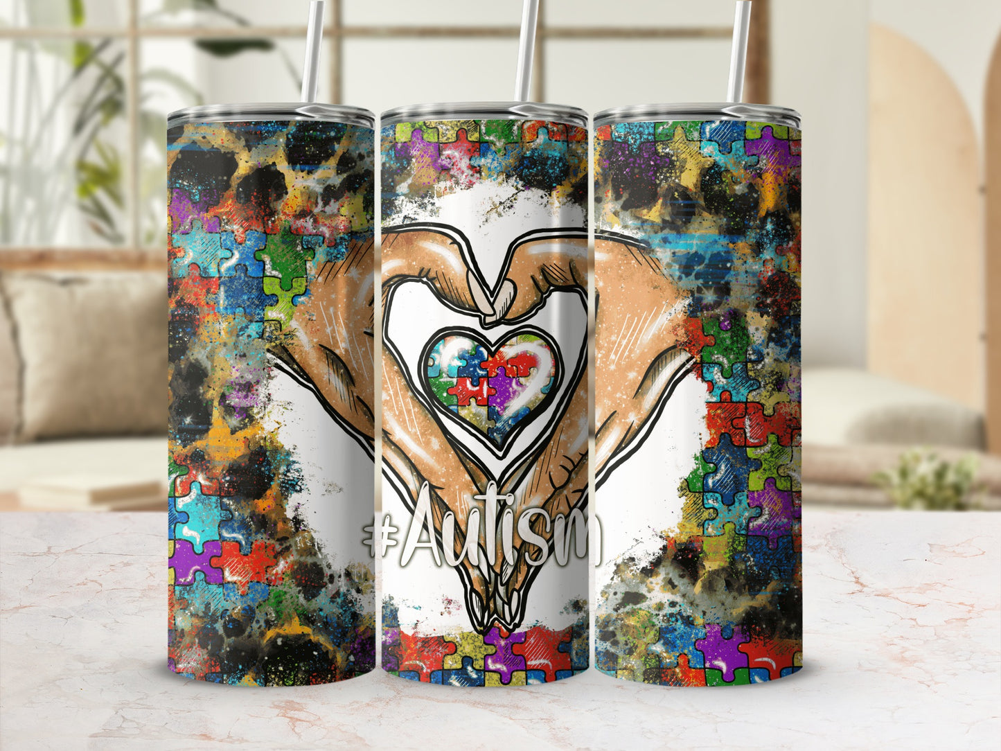 Tumbler with autism awareness puzzle heart, hands, and hashtag.