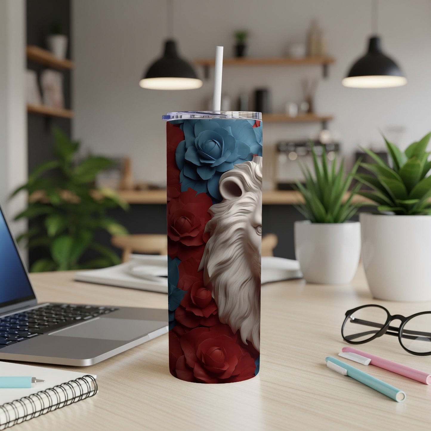 White lion head surrounded by red and blue roses on a tumbler.