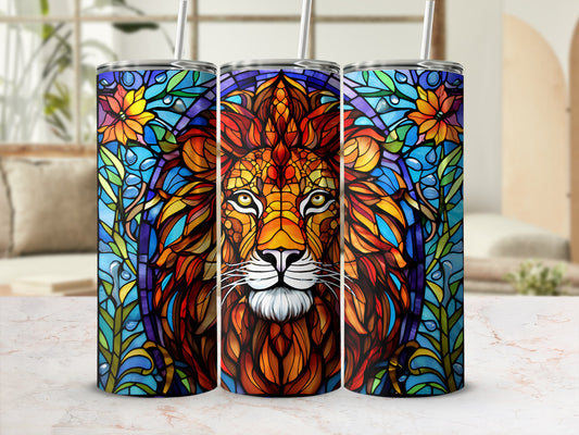 Stained glass lion face with floral accents on a colorful tumbler.