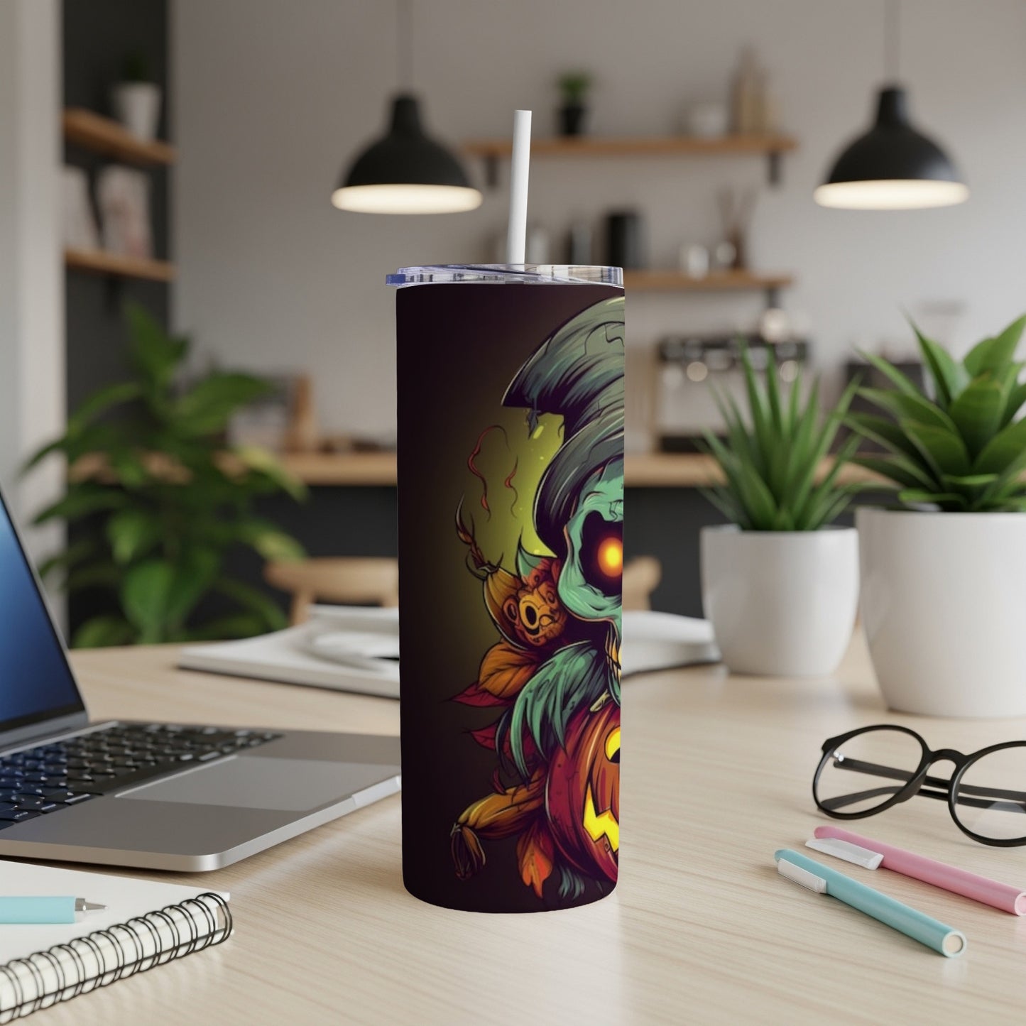 Halloween themed tumbler with a spooky character and pumpkin design.