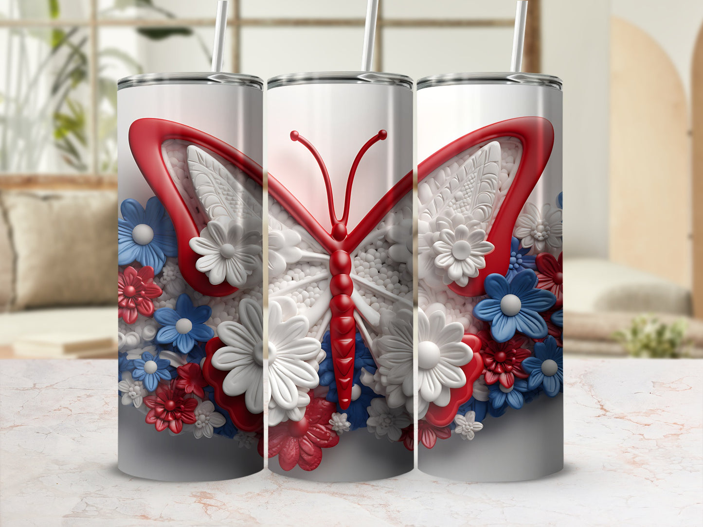 Three tumblers with a white butterfly and red and blue flowers.
