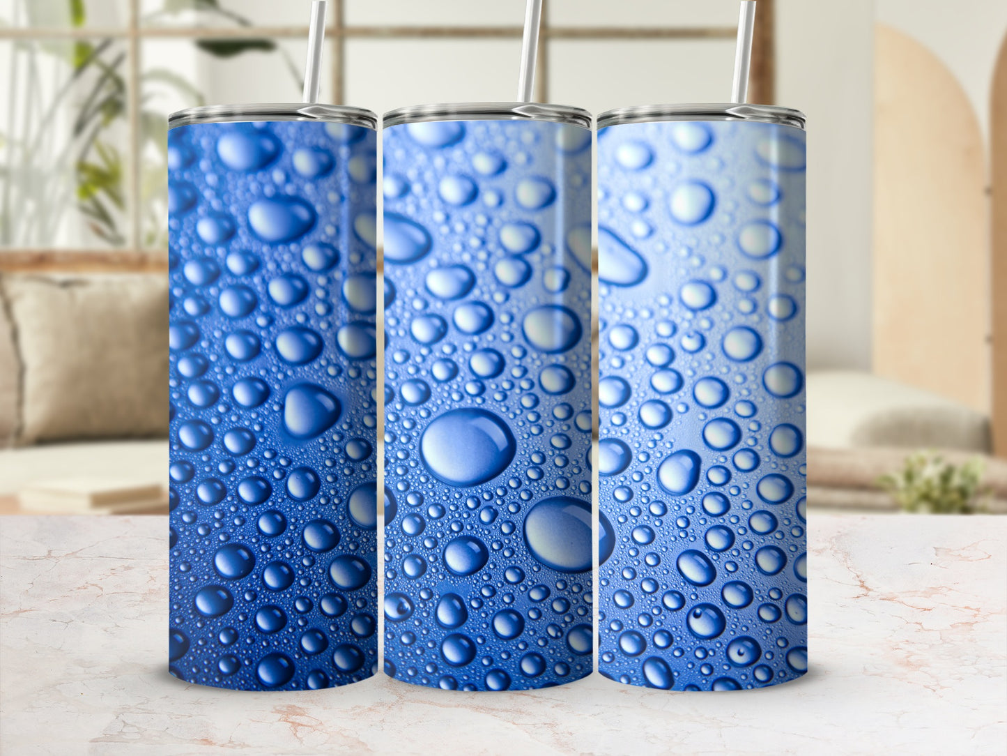 Three blue tumblers with a realistic water droplet design.