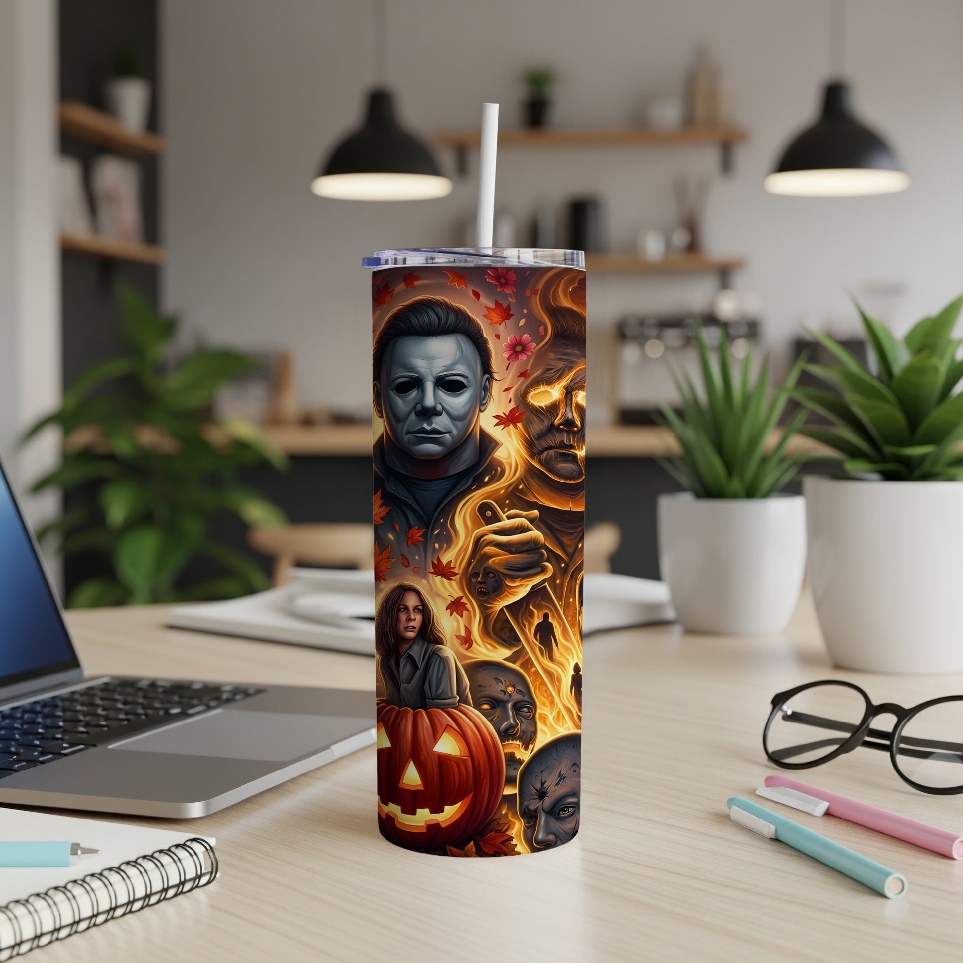 Tumbler featuring Michael Myers, flaming faces, a pumpkin, and autumn leaves.