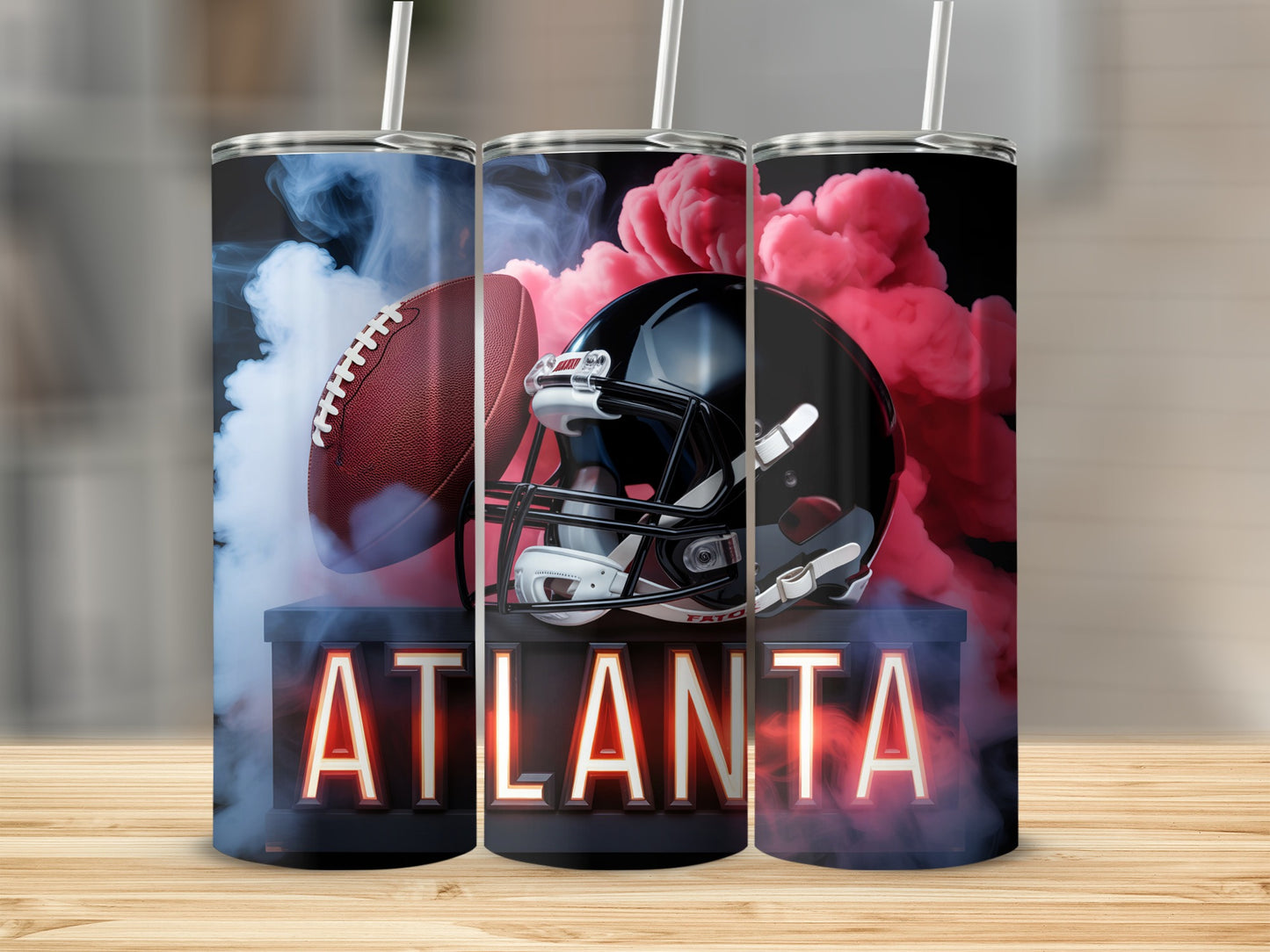 Atlanta Falcons football helmet and ball with smoky red background.