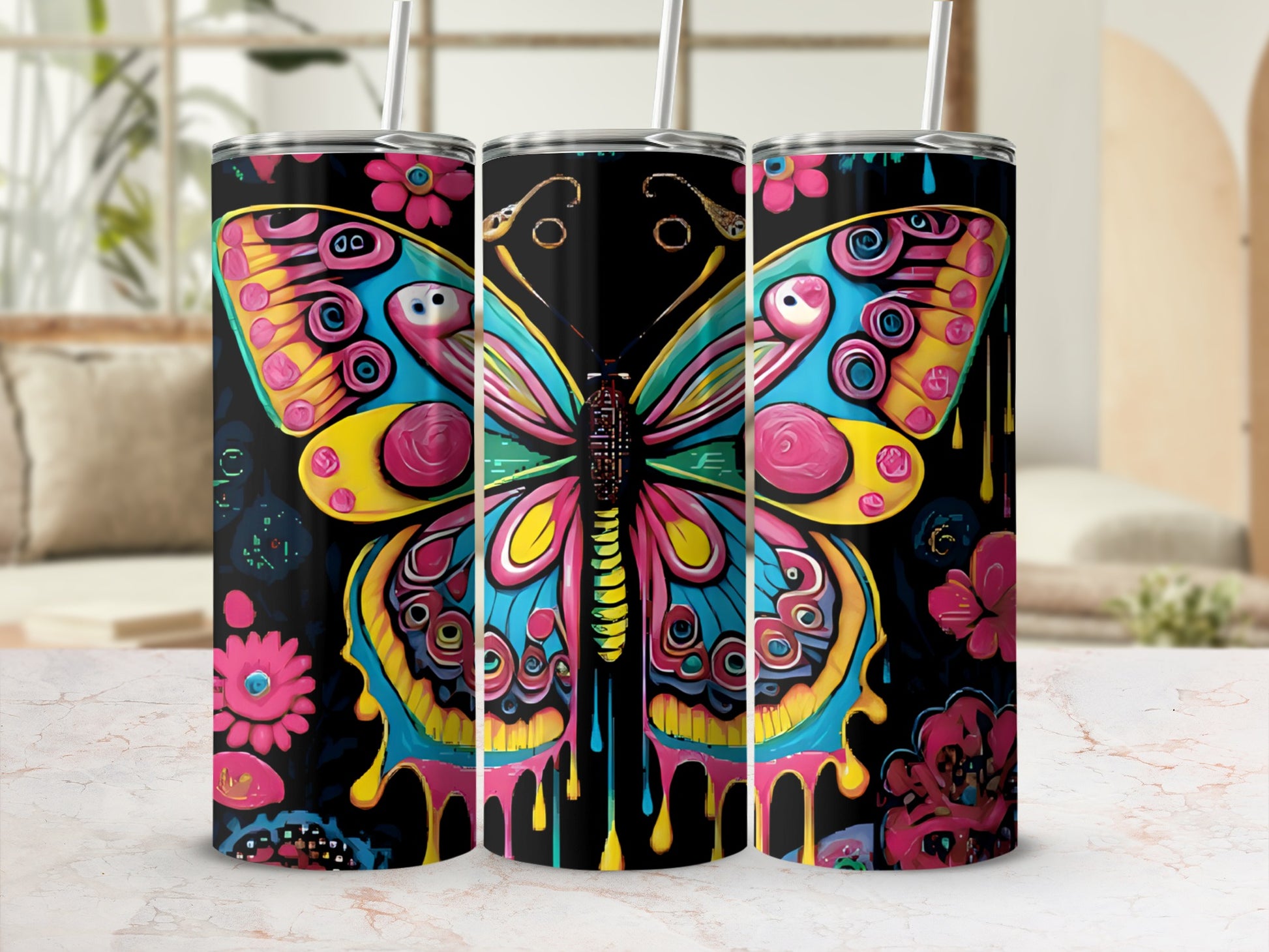 Colorful butterfly design with dripping paint effect on three tumblers.