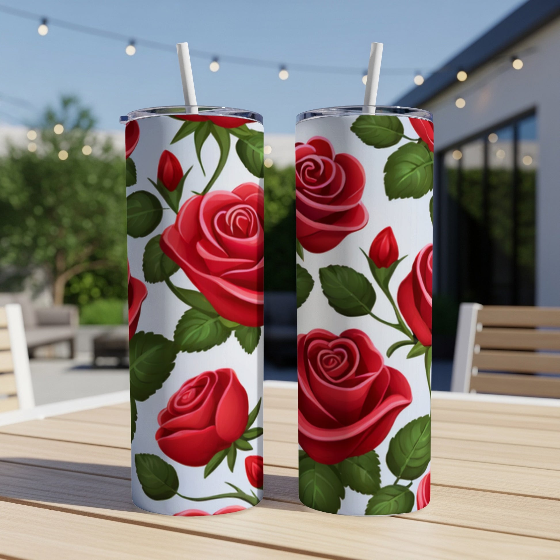 Two tumblers with red rose and green leaf pattern.
