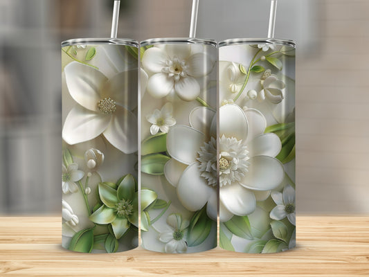 Three tumblers featuring white and green floral designs on a wooden surface.