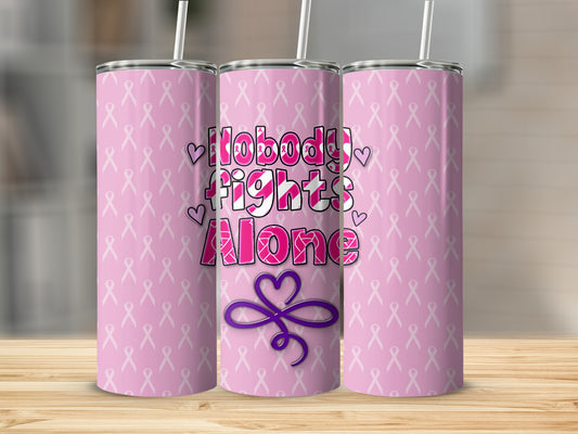 Pink tumbler with "Nobody Fights Alone" and pink ribbon pattern.