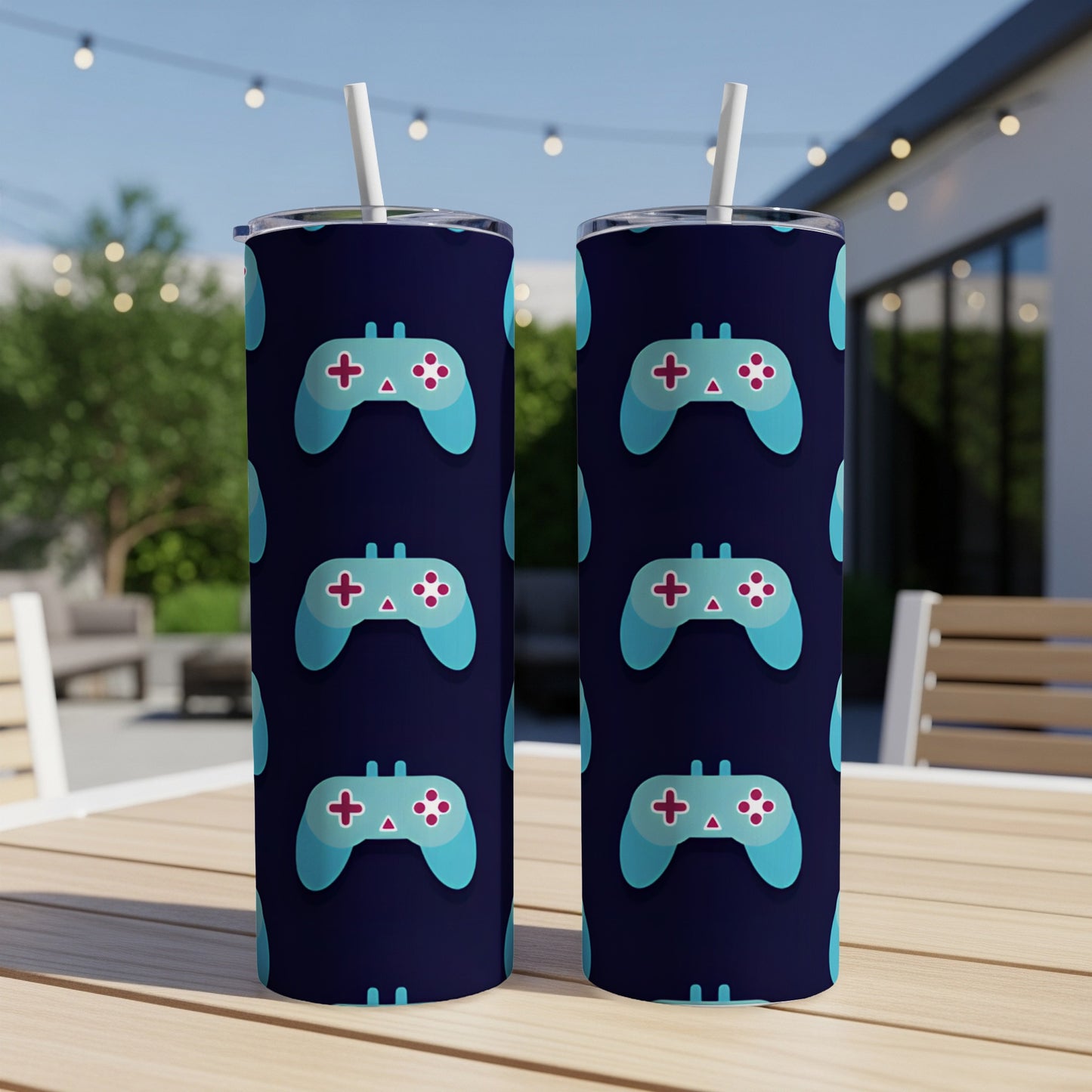 Two tumblers with a repeating pattern of blue video game controllers on a dark background.