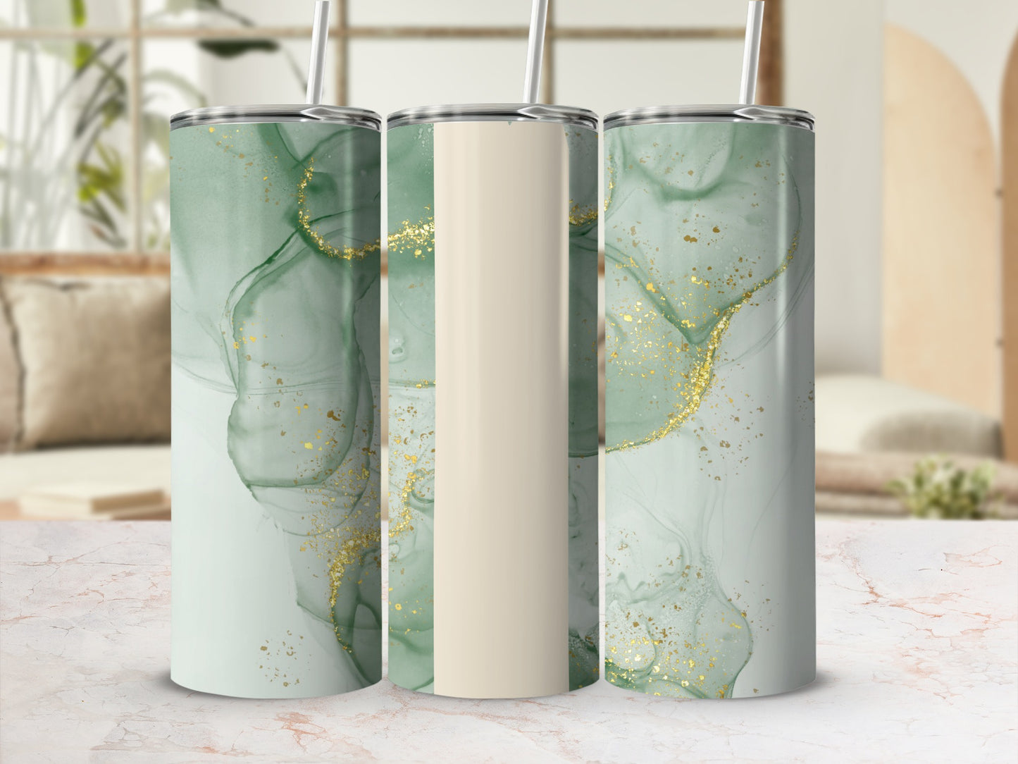 Three tumblers with a green and gold marble design and cream accents.