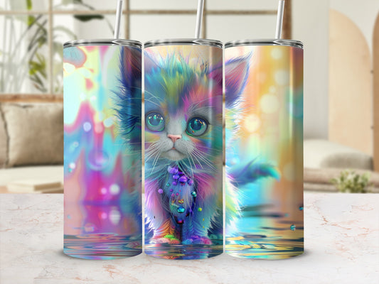 Colorful kitten with bright eyes on a white and marble surface.