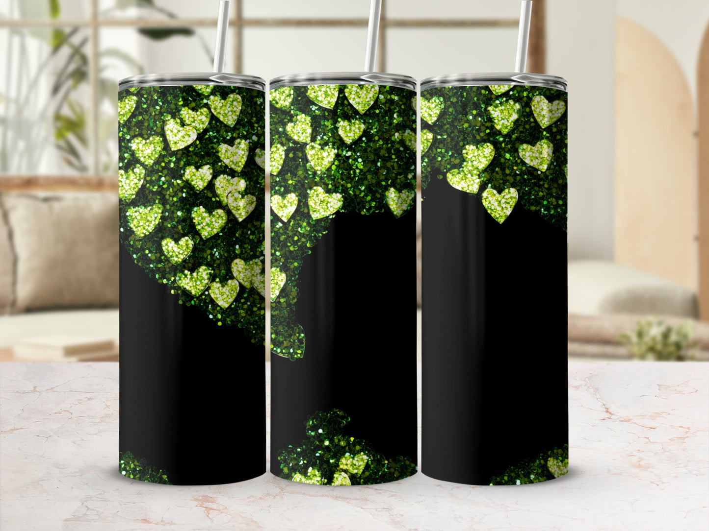 Three black tumblers with green glitter heart designs.