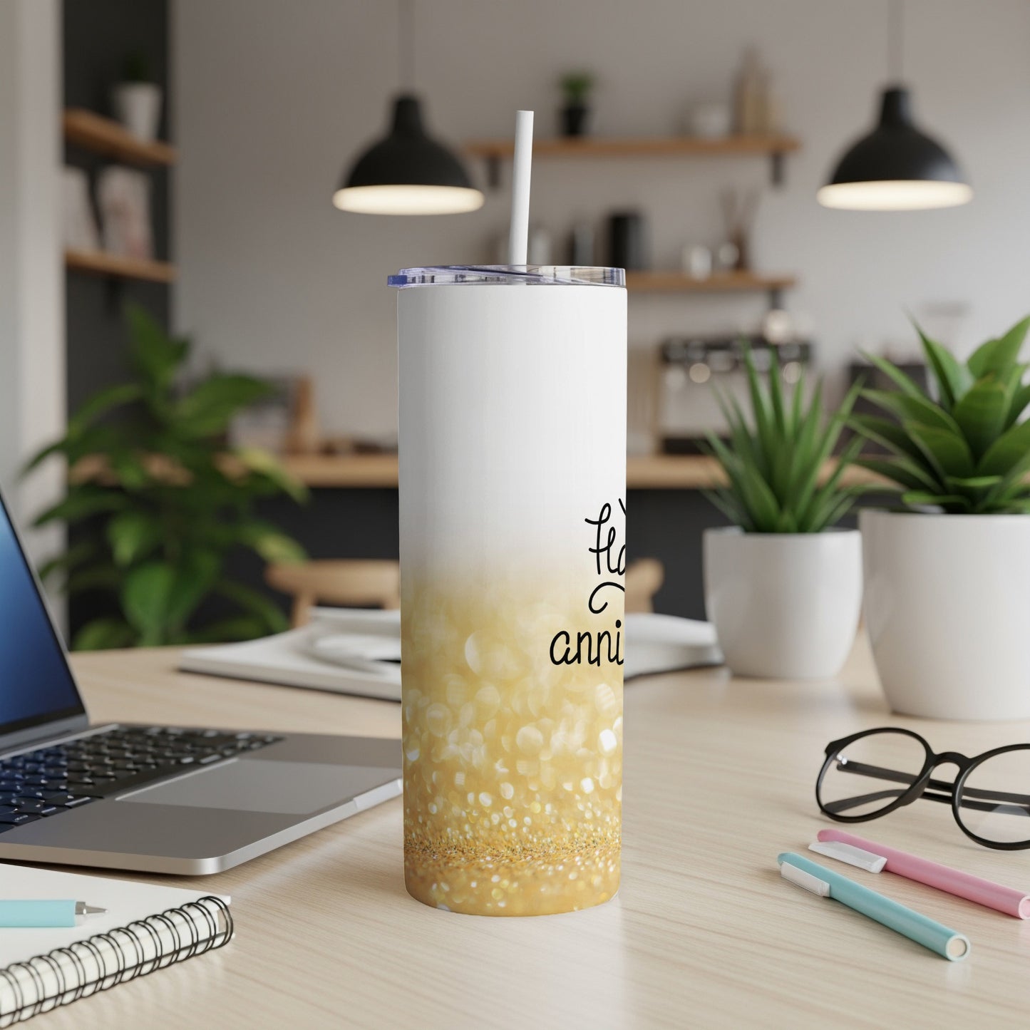 White tumbler with gold glitter, reads "happy anniversary."