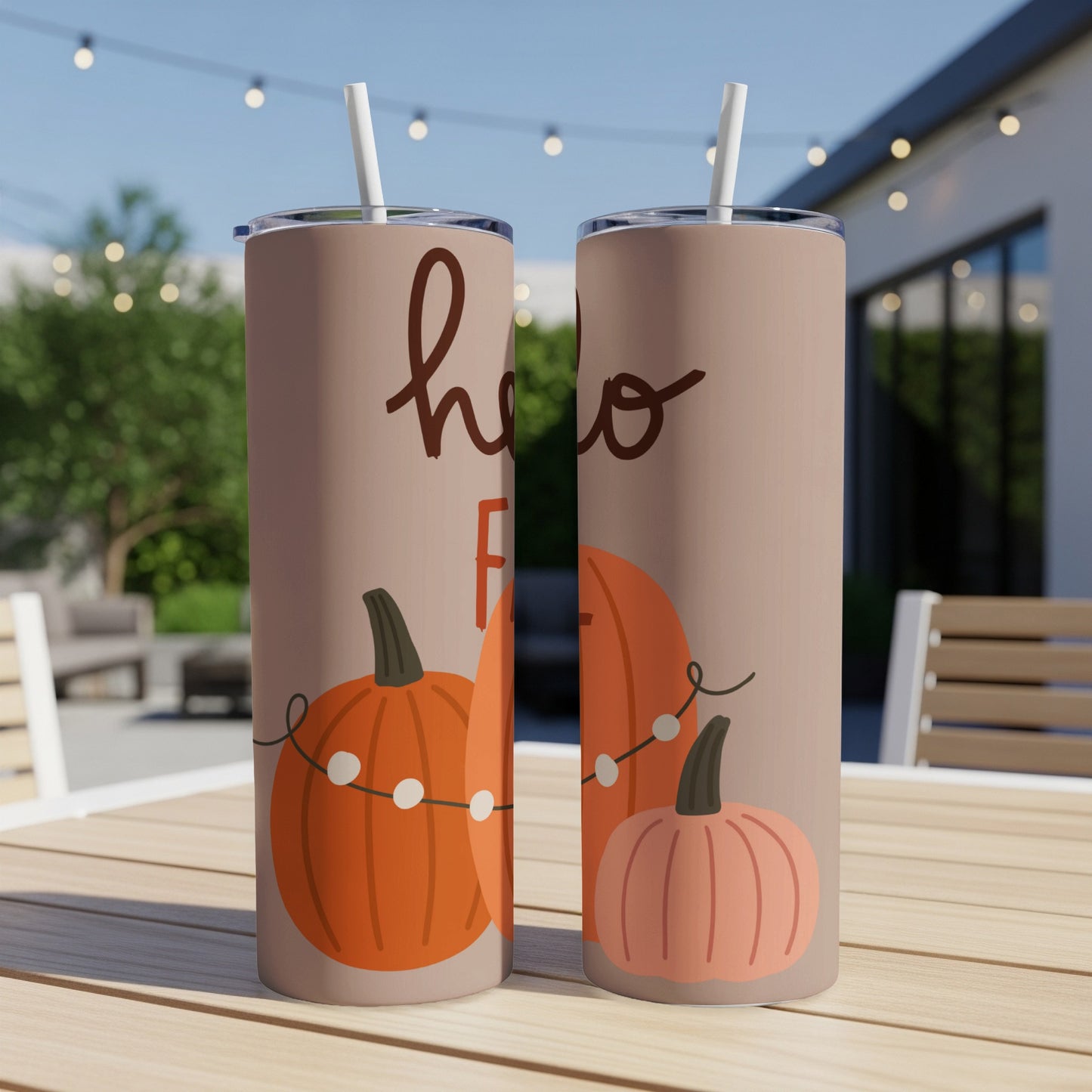 Two tumblers with "hello fall" text and pumpkin and string light illustrations.