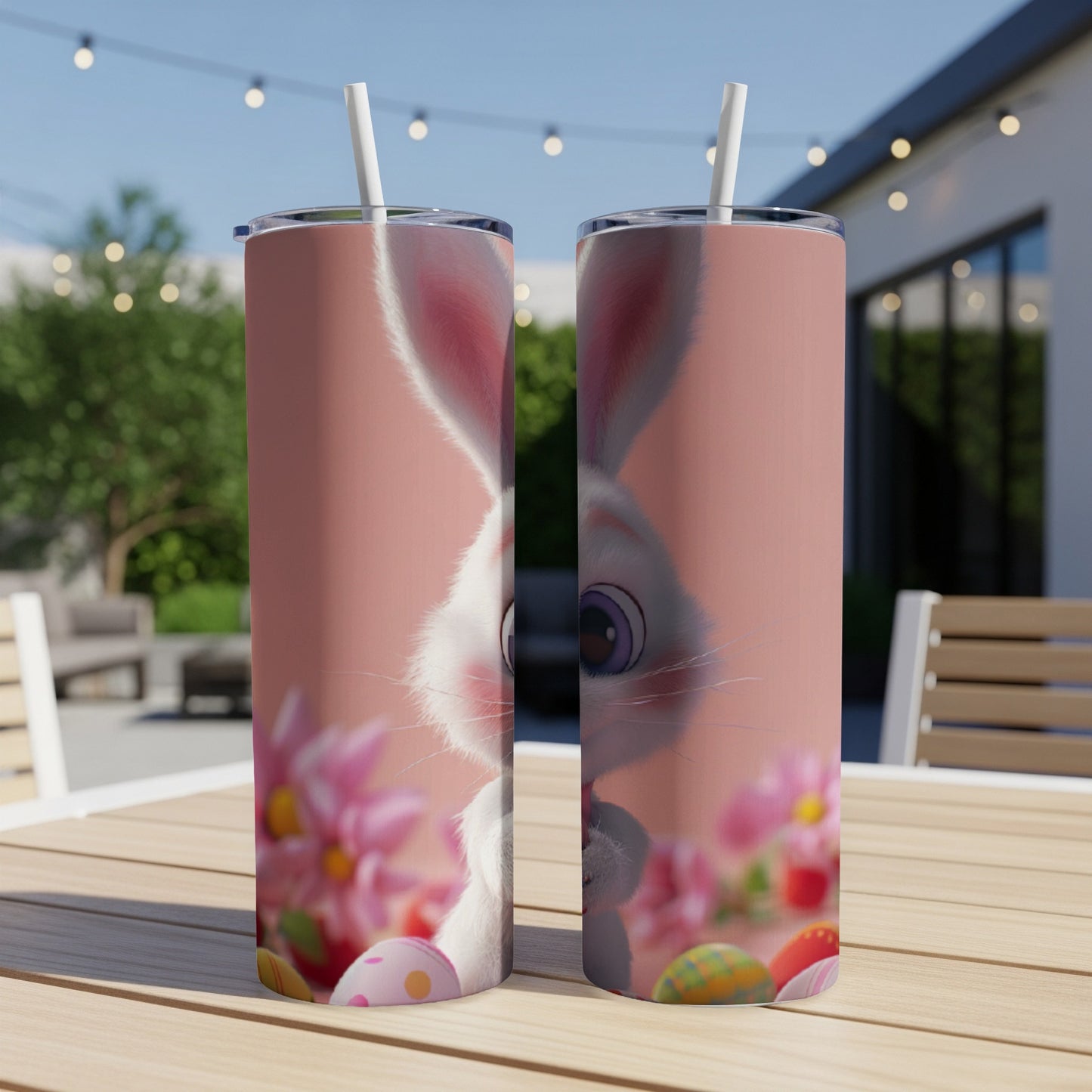 Two tumblers with a peeking bunny and Easter eggs on a pink background.