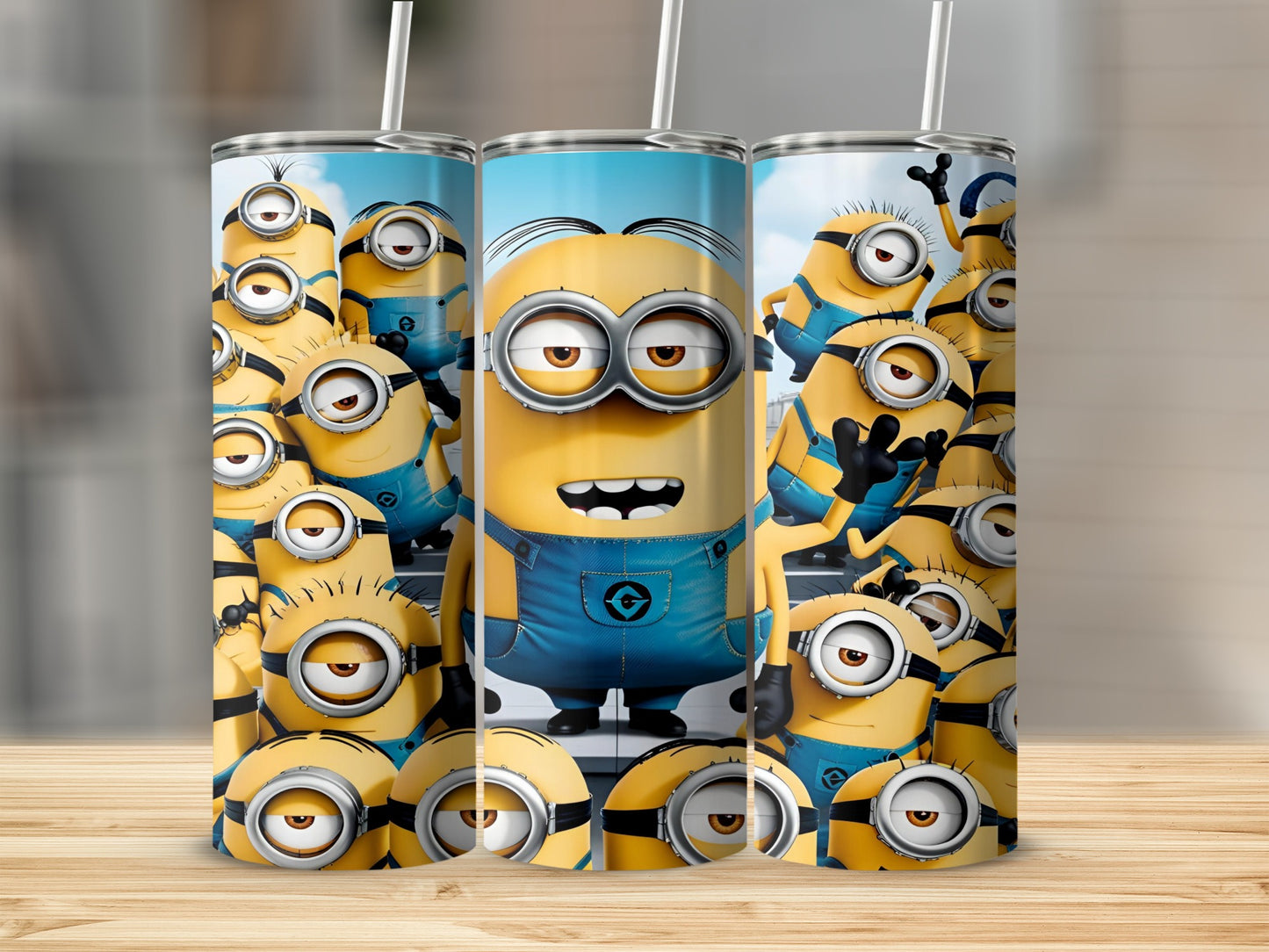 Three Minions tumblers with Minion characters printed on them.