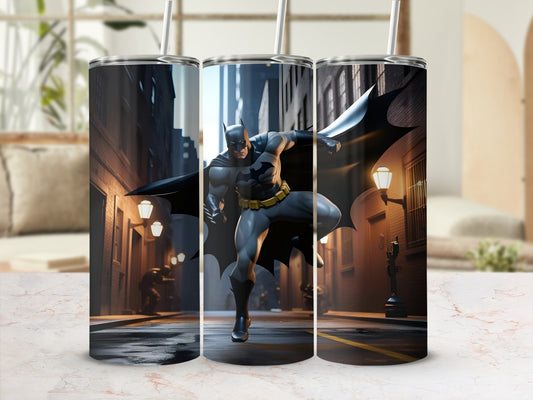 Batman in a dynamic pose on a city street, artwork on a tumbler.