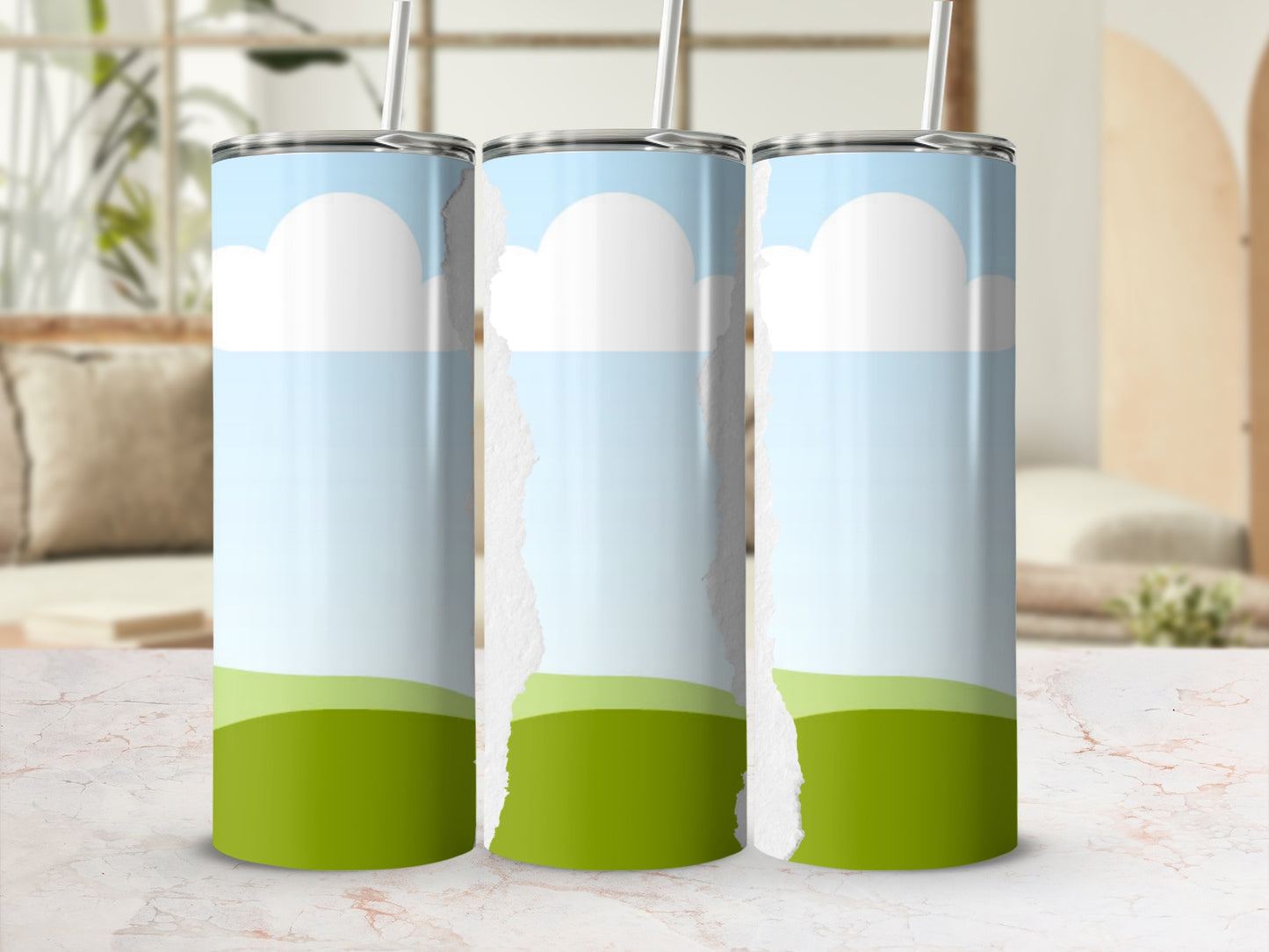 Three tumblers with a sky and grass design, separated by torn paper effect.