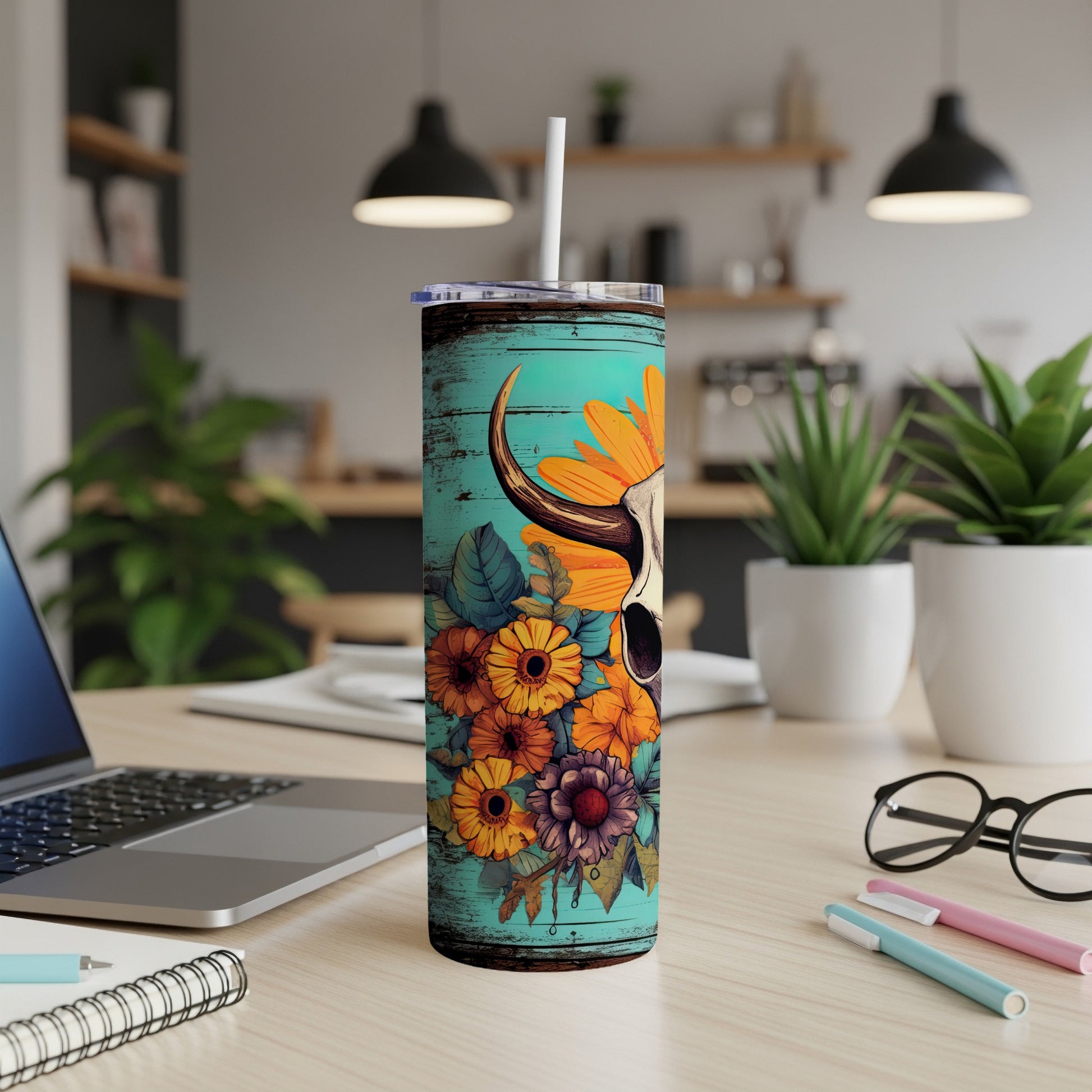 Teal tumbler with bull skull and sunflowers design.