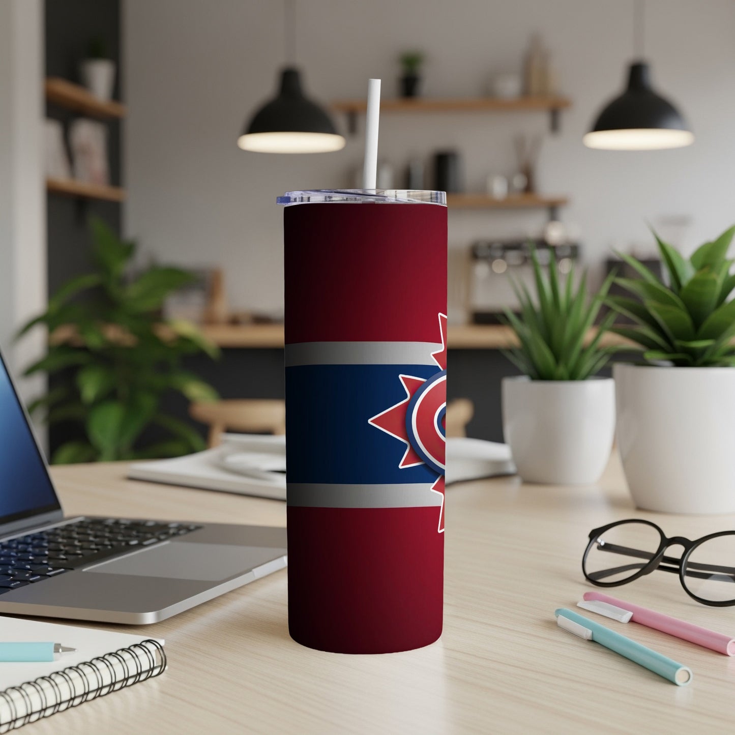 Maroon tumbler with blue and gray stripes and a red star logo with white trim.