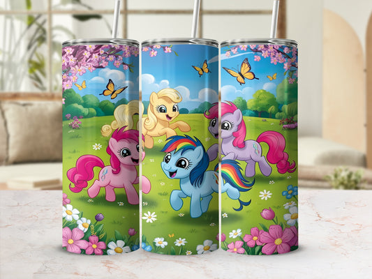 Three My Little Pony characters in a field of flowers under a blue sky.