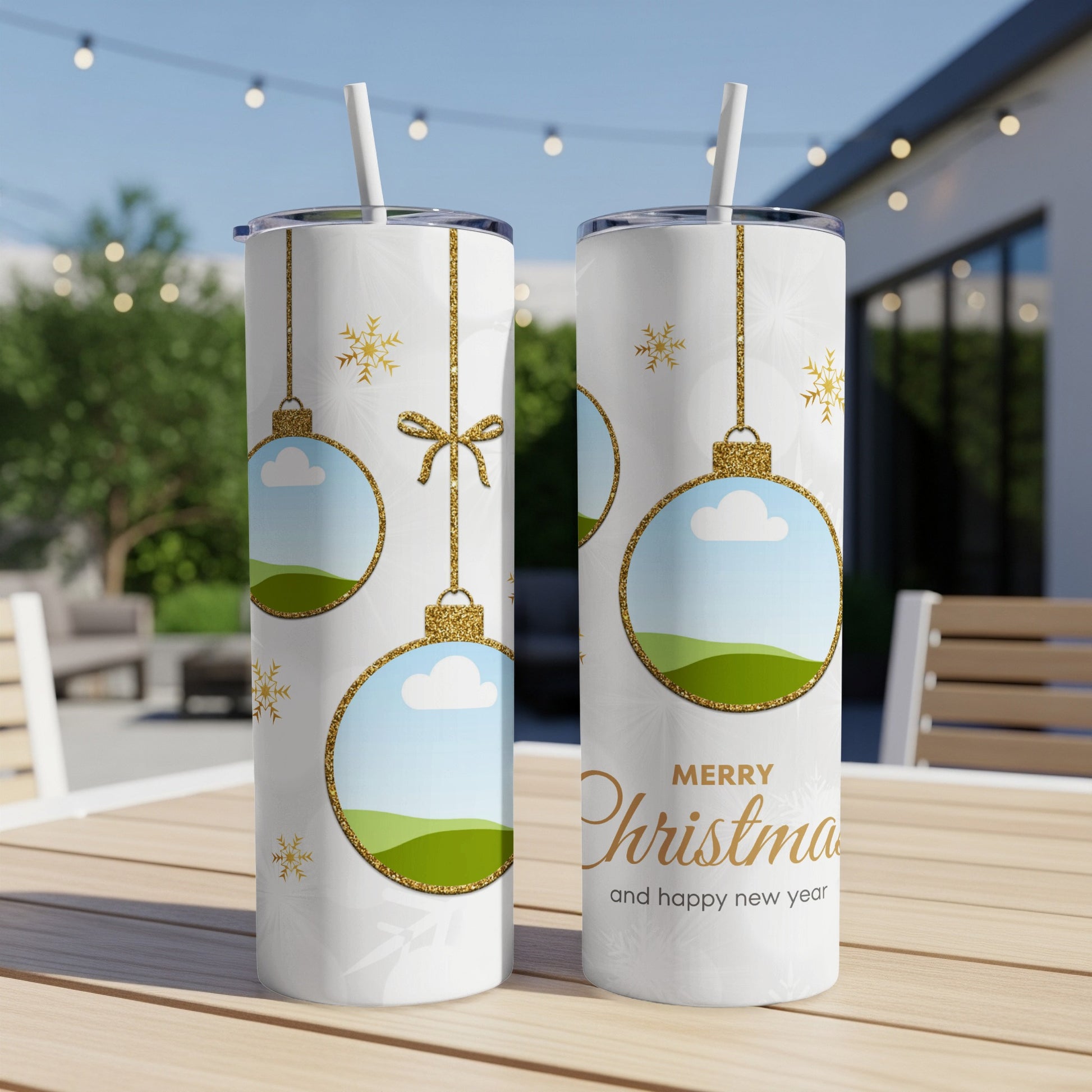 Two white tumblers with Christmas ornaments and snowflakes design, with text "Merry Christmas and happy new year".