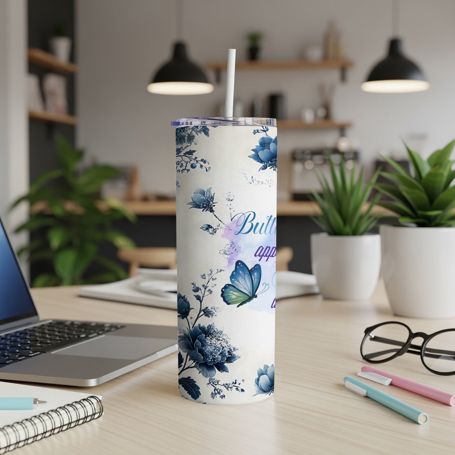 Blue floral tumbler with butterfly and "Butterfly" text.