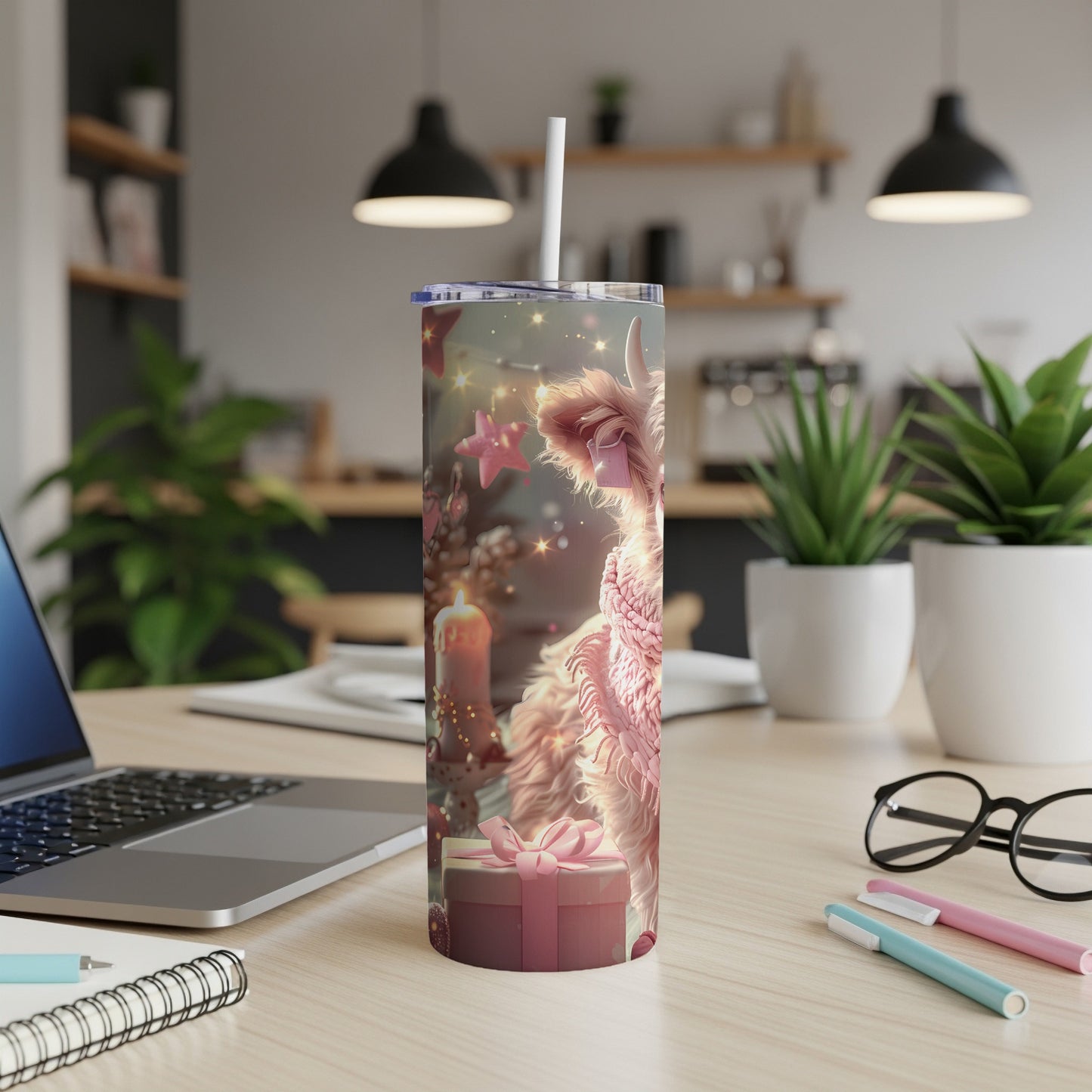 Pink llama in festive scarf on a decorated tumbler with a gift.