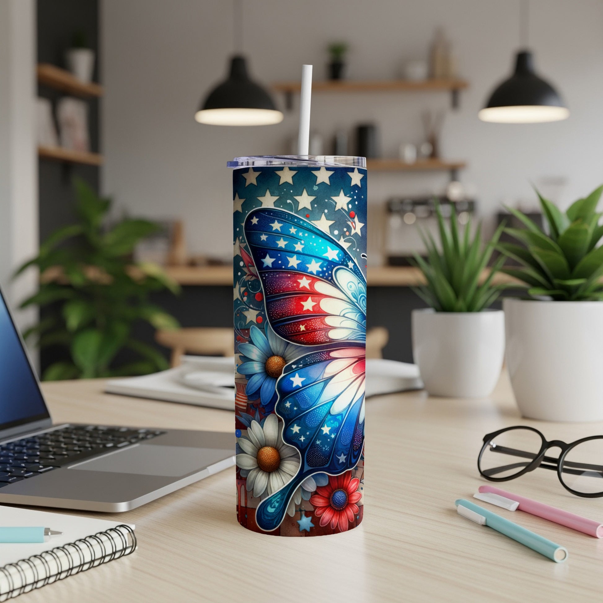 Red, white, and blue butterfly tumbler with patriotic stars and flowers.