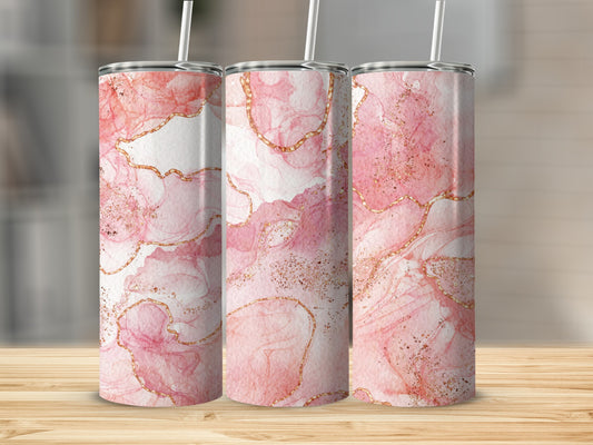 Three tumblers with pink marble and gold swirl designs.