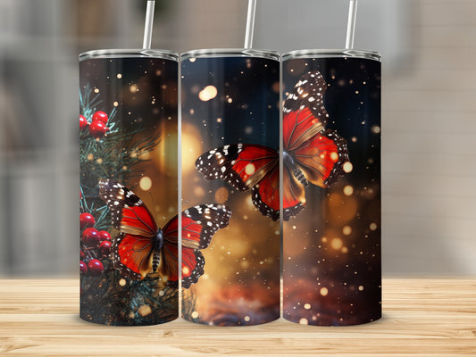 Three tumblers with vibrant red butterflies and festive holiday greenery.