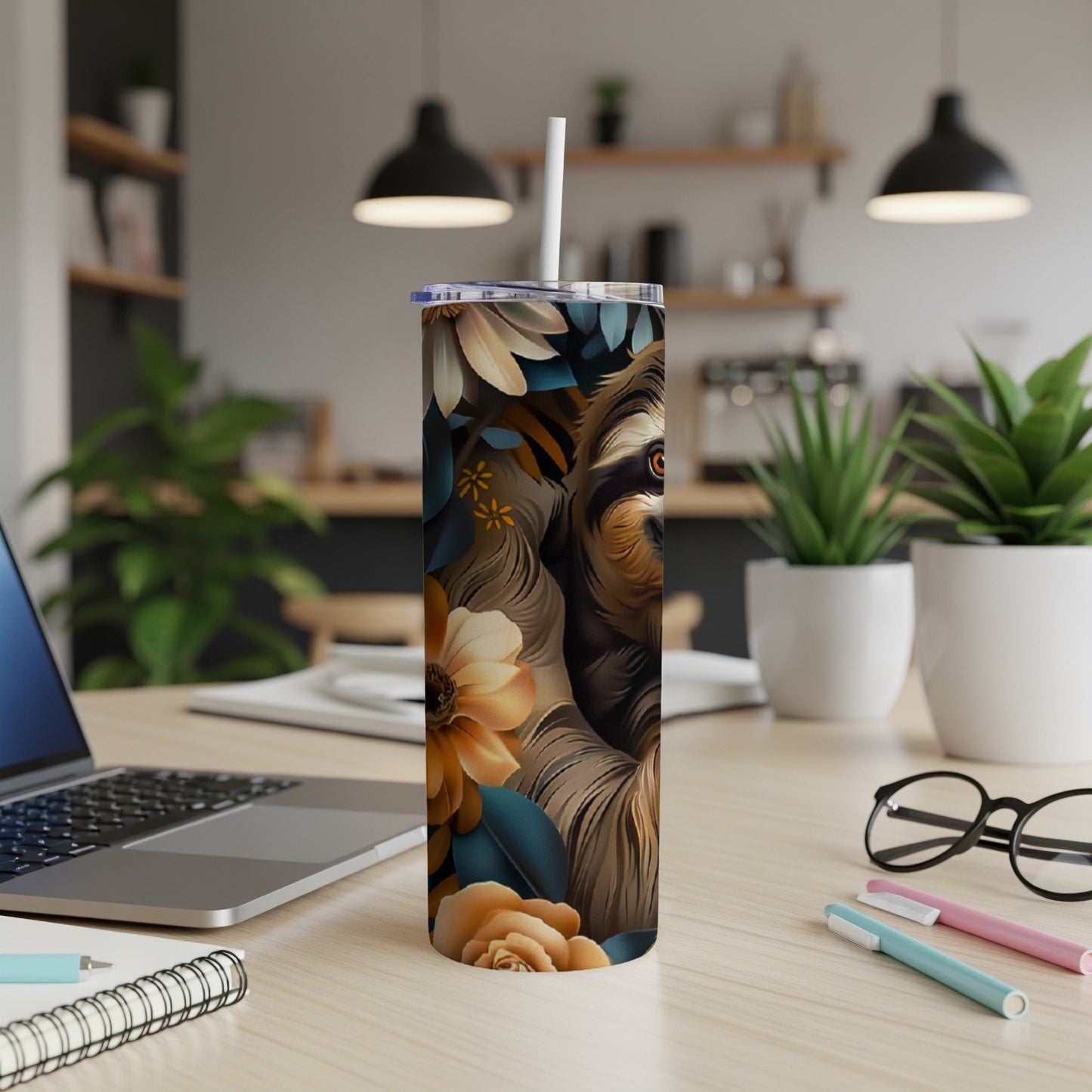 Sloth with flowers and leaves design on a stainless steel tumbler.